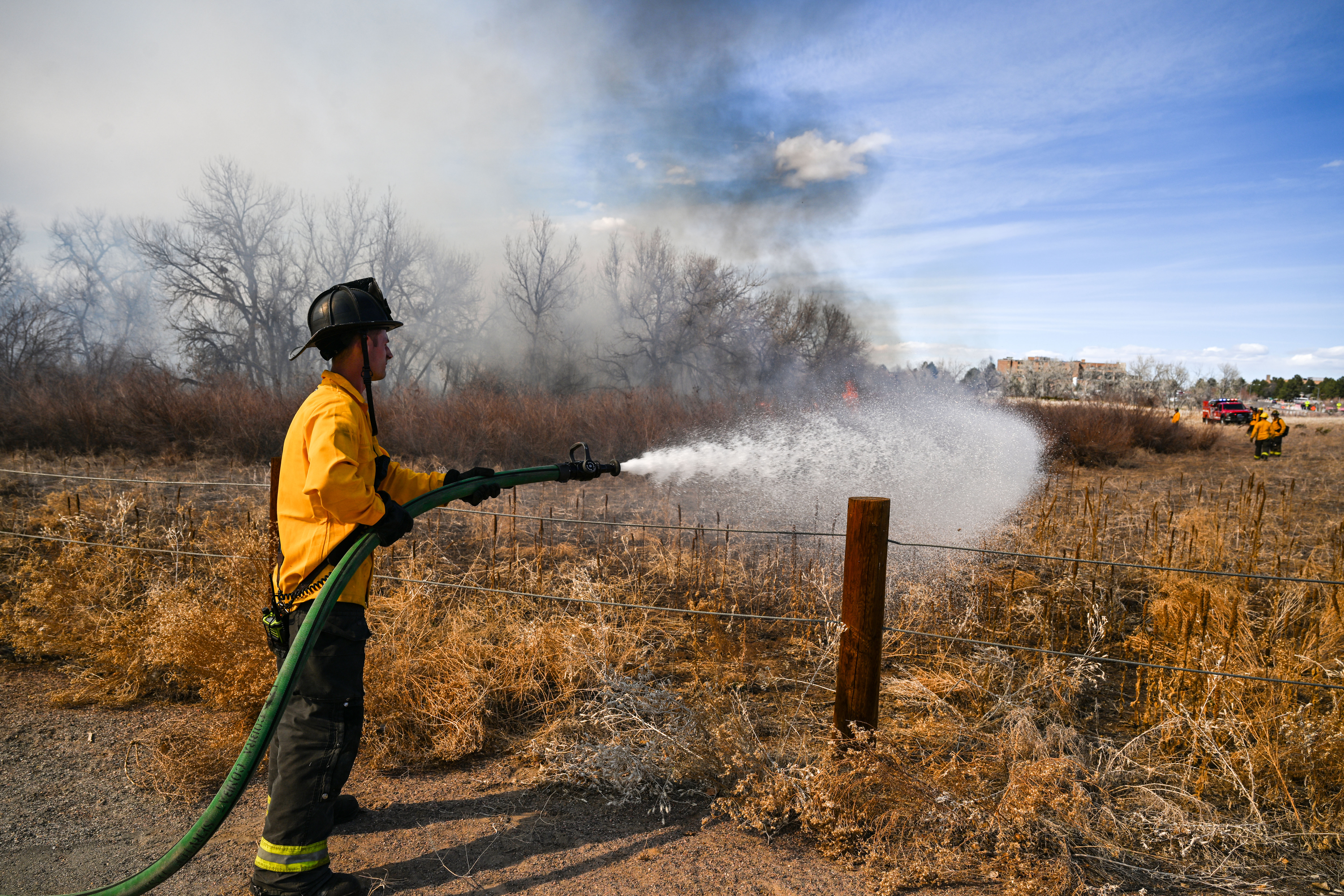 Aurora firefighters combat a wildfire at Jewell Wetlands Park in Aurora on Friday, March 21, 2025. (Stephen Swofford, Denver Gazette) (StephenSwoffordPhotographerstephen.swofford@gazette.comhttps://secure.gravatar.com/avatar/1ddcaf11c5d70eaa58546ddc4e038687?d=mm&r=g)