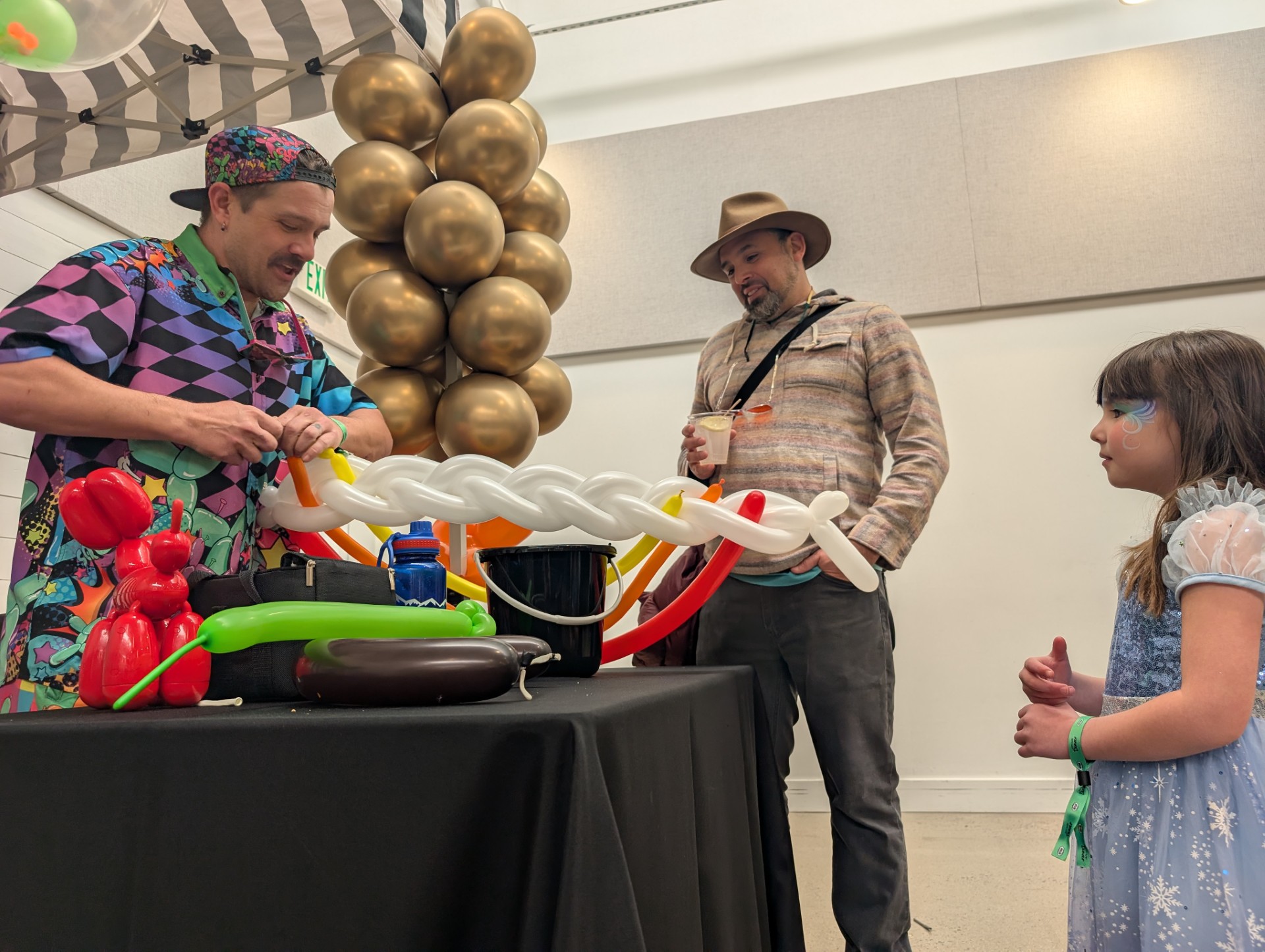 Jeremy, the Denver Balloon Guy, makes a balloon sculpture for six-year-old Ellery at the HEYDAY festival on Saturday — a celebration hosted by City Cast Denver. (SageKelleyJefferson County Reportersage.kelley@denvergazette.comhttps://denvergazette.com/content/tncms/avatars/e/5f/457/e5f45740-2717-11ee-85b2-ab80f2d36252.5b966c1d2ce4987987665d57c237eda4.png)