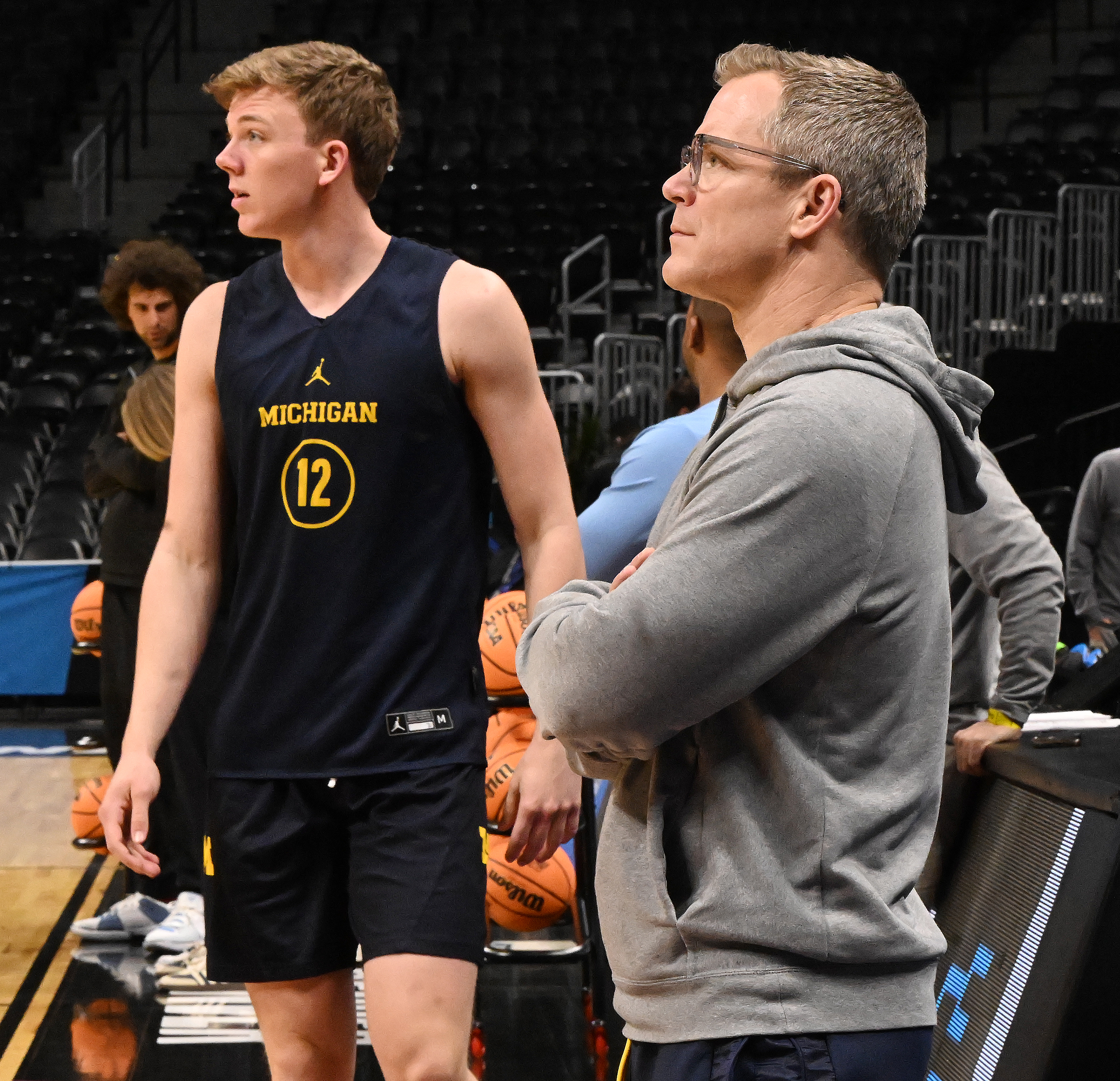 Michigan’s Charlie May plays basketball for his father and Michigan Head Coach Dusty May. He was practicing with the team on March 19, 2025, at Ball Arena for the NCAA March Madness tournament. The first round of the tournament starts on Thursday. (Jerilee Bennett,The Gazette)