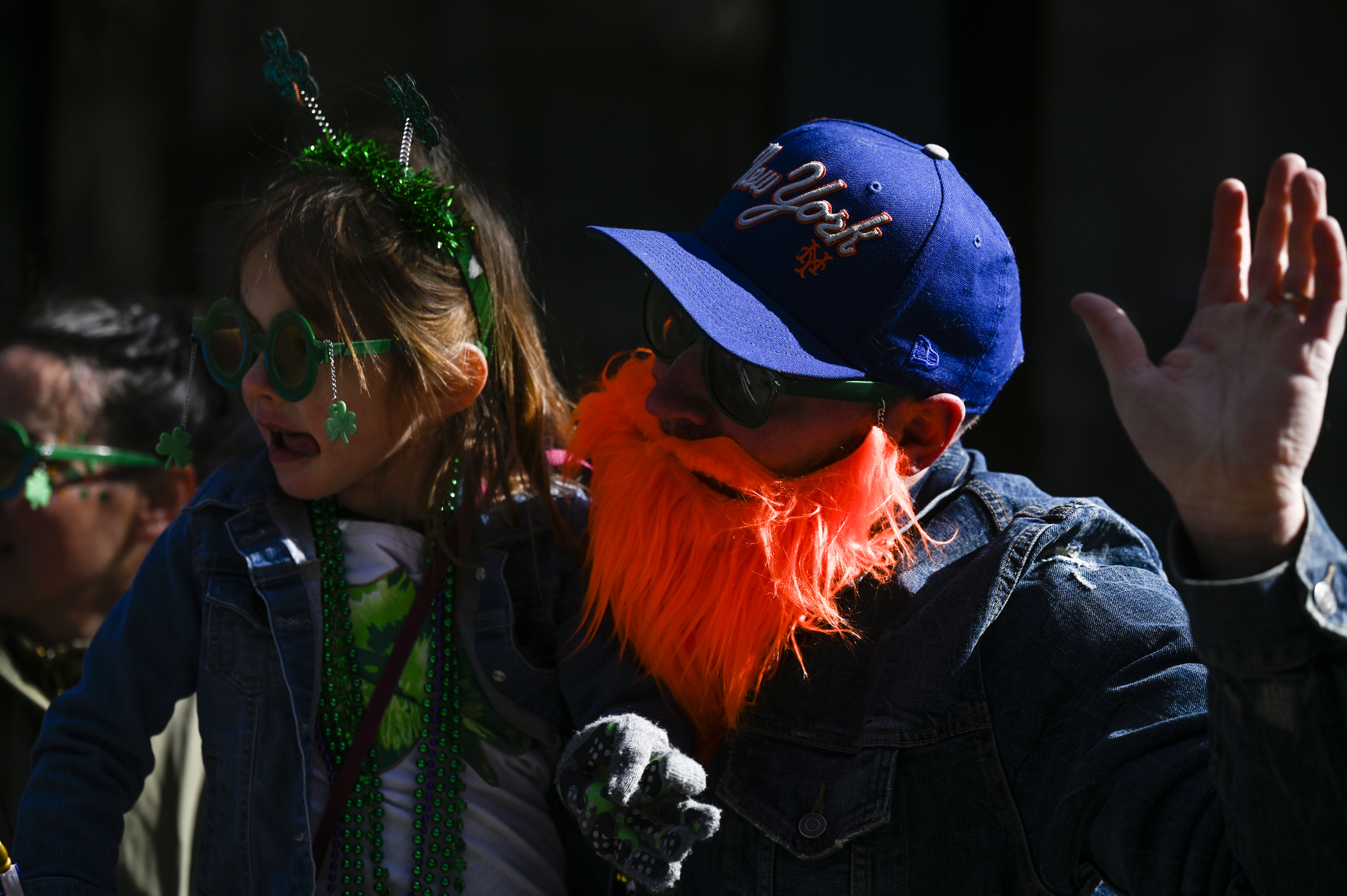 Chris Buscemi and his daughter Isla, 6, watch the St. Patrick’s Day Parade in Denver on Saturday, March 15, 2025 (Stephen Swofford, Denver Gazette) (Stephen Swofford/ Denver Gazette)