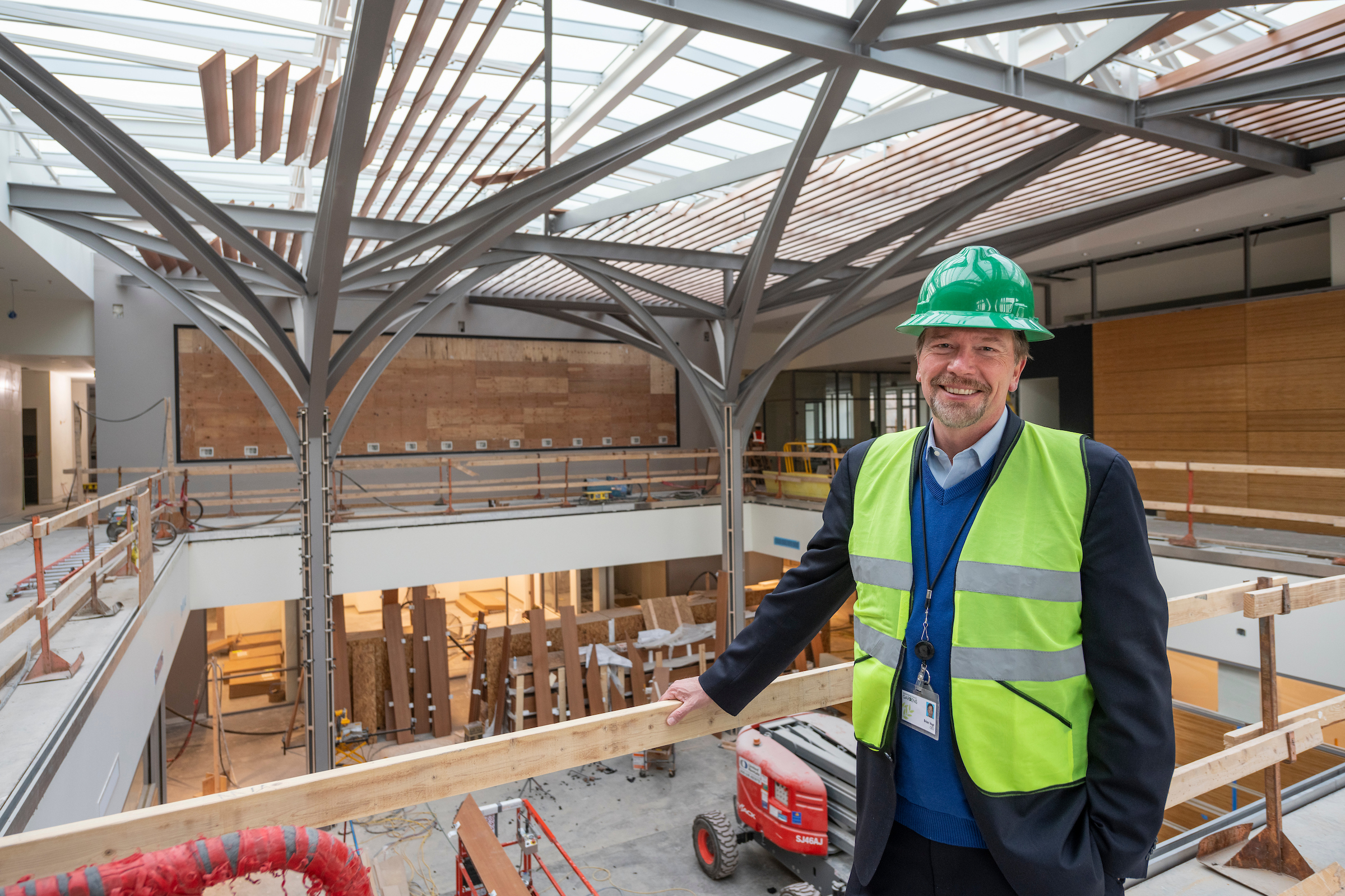 Brian Vogt spearheaded a master development plan that surpassed $115 million in improvements and endowment support. One of his favorite projects is the Freyer – Newman Center for science, art and education, which opened in 2020. Vogt is pictured in the building that includes an atrium with big screens, six classrooms, a new library and a new herbarium, four art galleries, two open air decks, a conservation genetics lab and a 272-seat auditorium which screens Denver Botanic Films for which Vogt served as executive producer. (Courtesy photo, Scott Dressel-Martin/Denver Botanic Gardens)