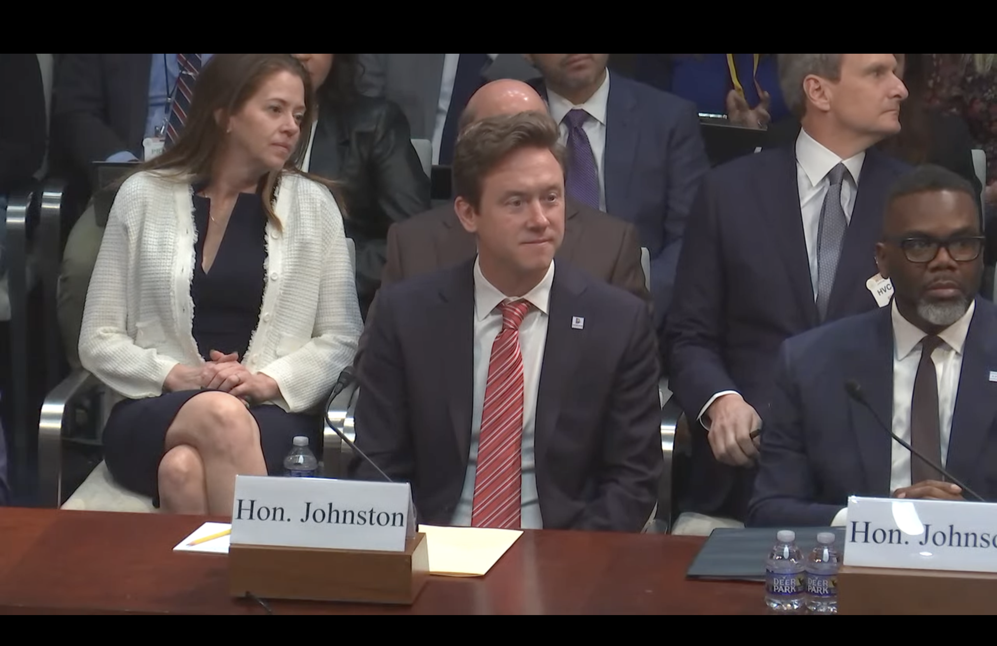 Denver Mayor Mike Johnston answers questions during a March 5 hearing on 