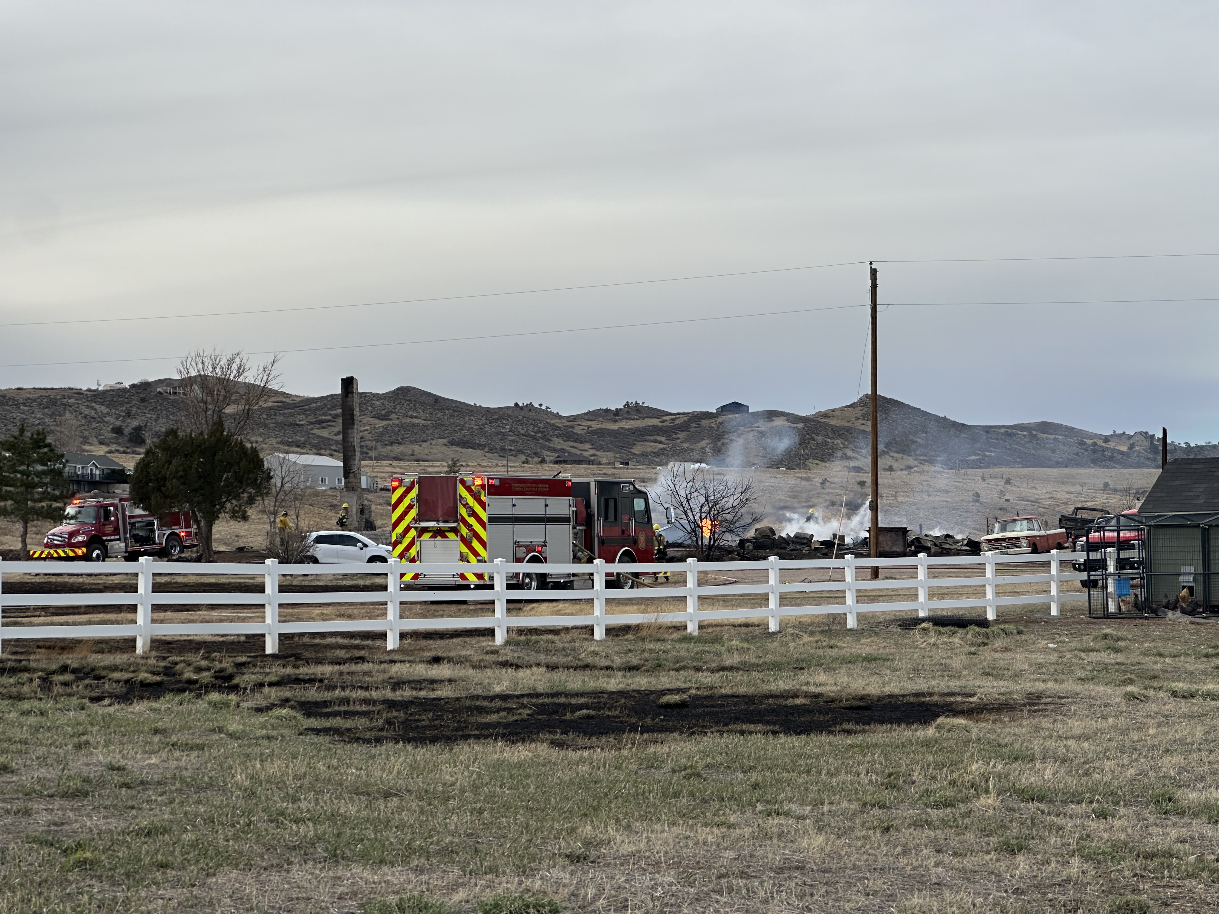 Firefighters put out a 30-acre grassfire west of Berthoud that caused evacuations and destroyed one home Monday. (Jason Van Vleet/Special to The Denver Gazette)