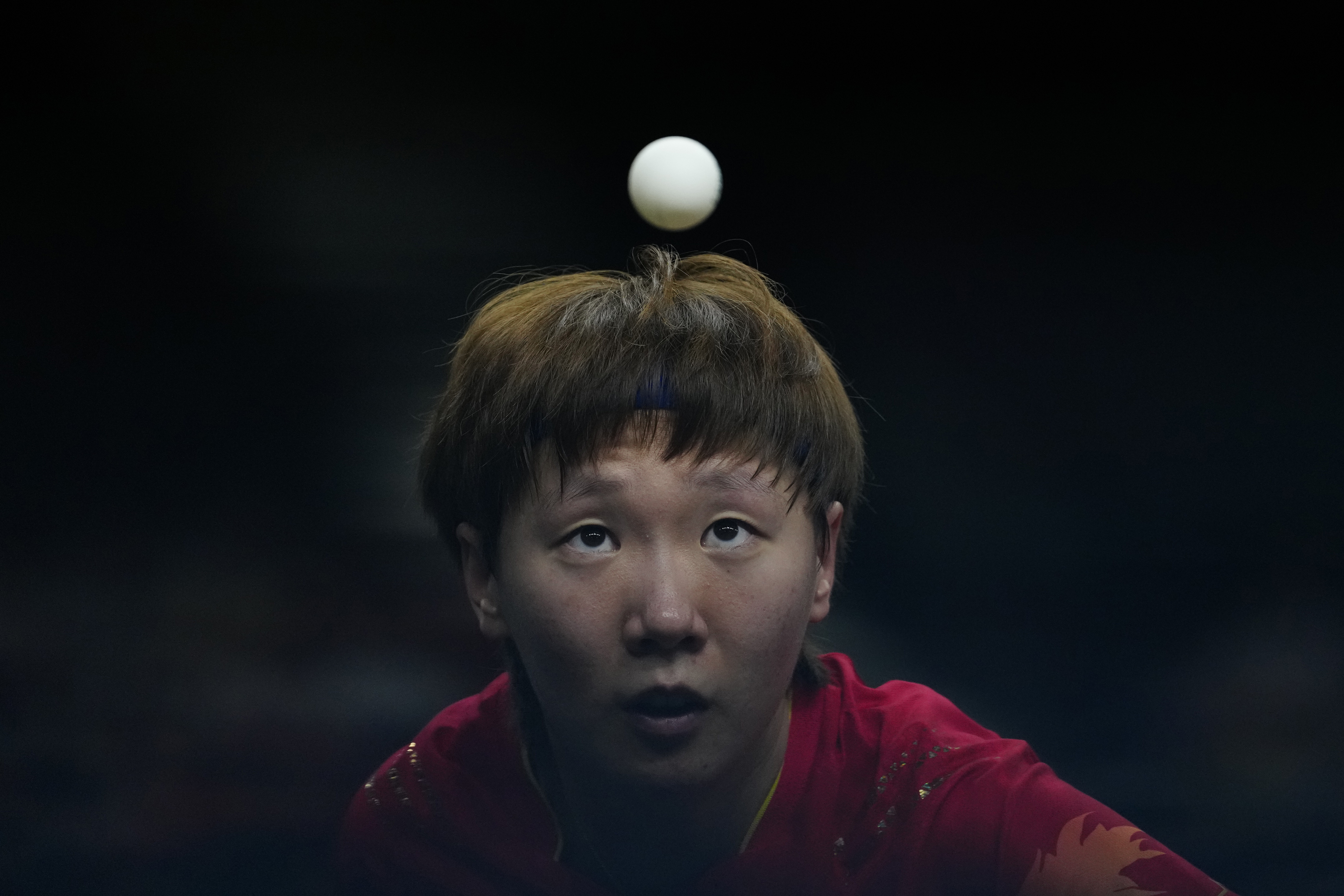 China's Wang Manyu plays against Japan's Miwa Harimoto during the women's gold medal team table tennis match at the 2024 Summer Olympics, Saturday, Aug. 10, 2024, in Paris, France. (AP Photo/Petros Giannakouris) (Petros Giannakouris)