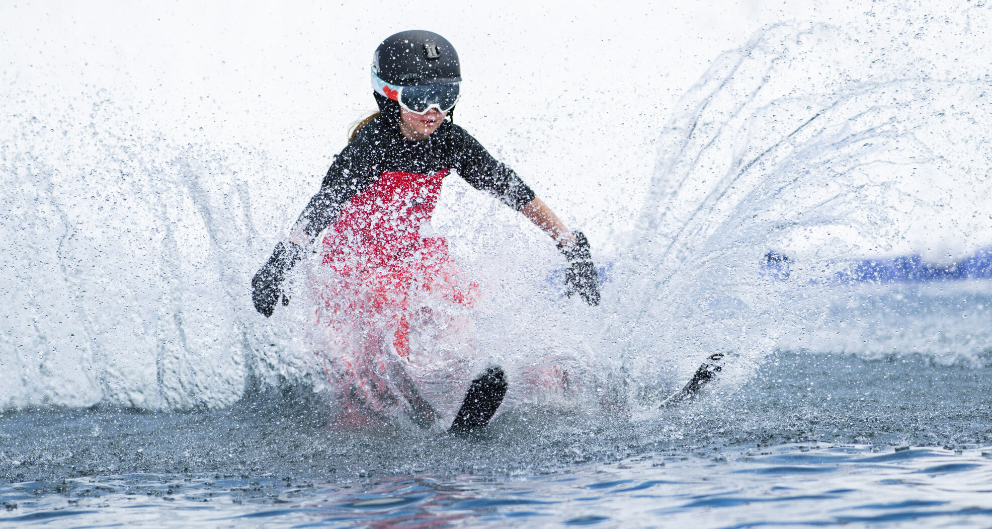 A young skier hits the cold water Saturday, April 2, 2022, during the 2022 Pond Skim on the closing weekend of skiing at Crested Butte Mountain Resort. Sunday is the last day at the Colorado ski resort. (The Gazette, Christian Murdock) (Christian Murdock/The Gazette)