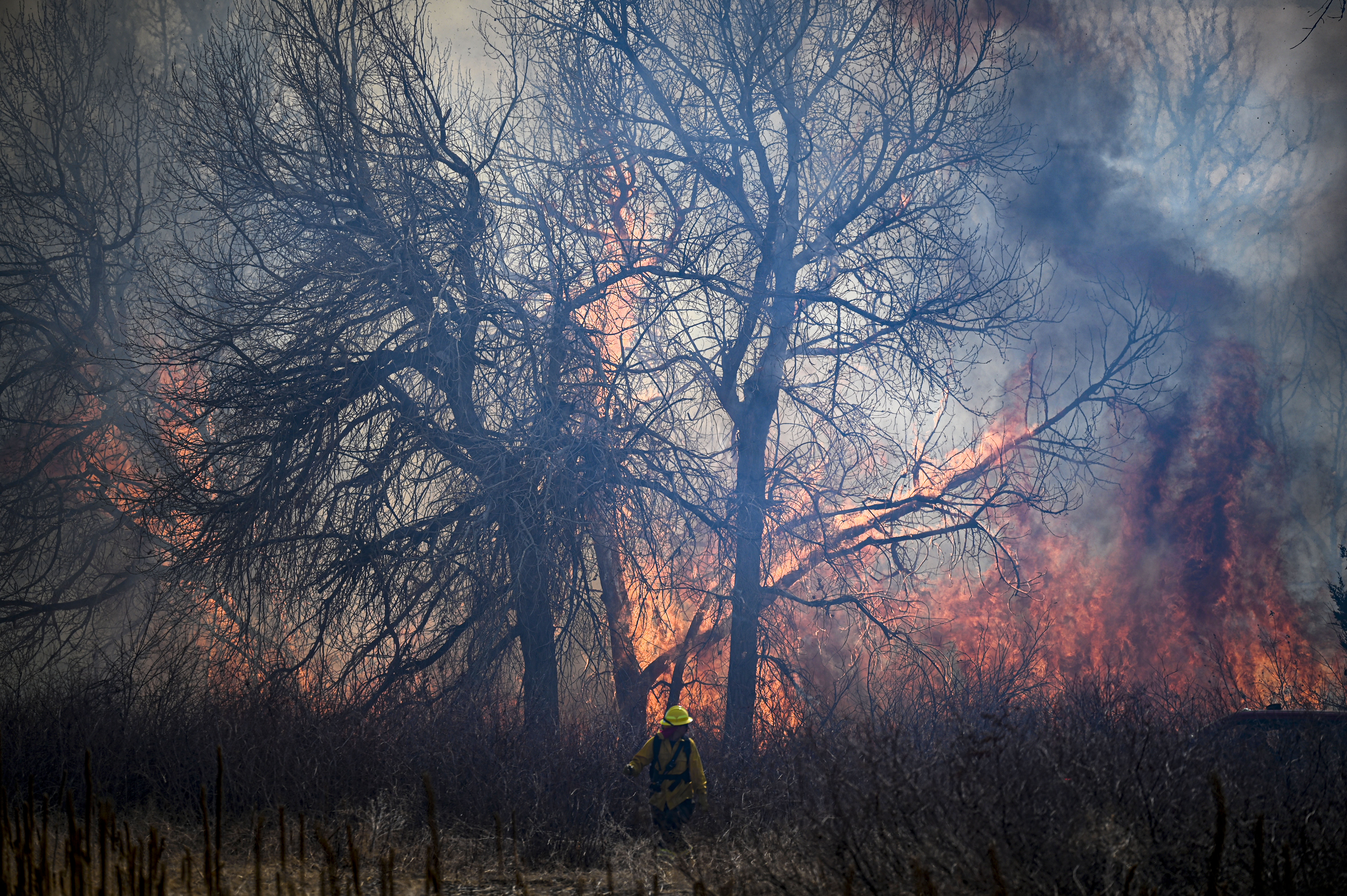 Aurora firefighters combat a wildfire at Jewell Wetlands Park in Aurora on Friday, March 21, 2025. (Stephen Swofford, Denver Gazette) (StephenSwoffordPhotographerstephen.swofford@gazette.comhttps://secure.gravatar.com/avatar/1ddcaf11c5d70eaa58546ddc4e038687?d=mm&r=g)