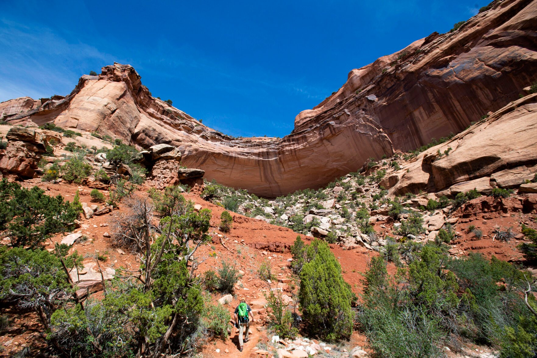 A hiker begins the 600-foot ascent from Monument Canyon to the plateau above in Colorado National Monument. (Christian Murdock, The Gazette)