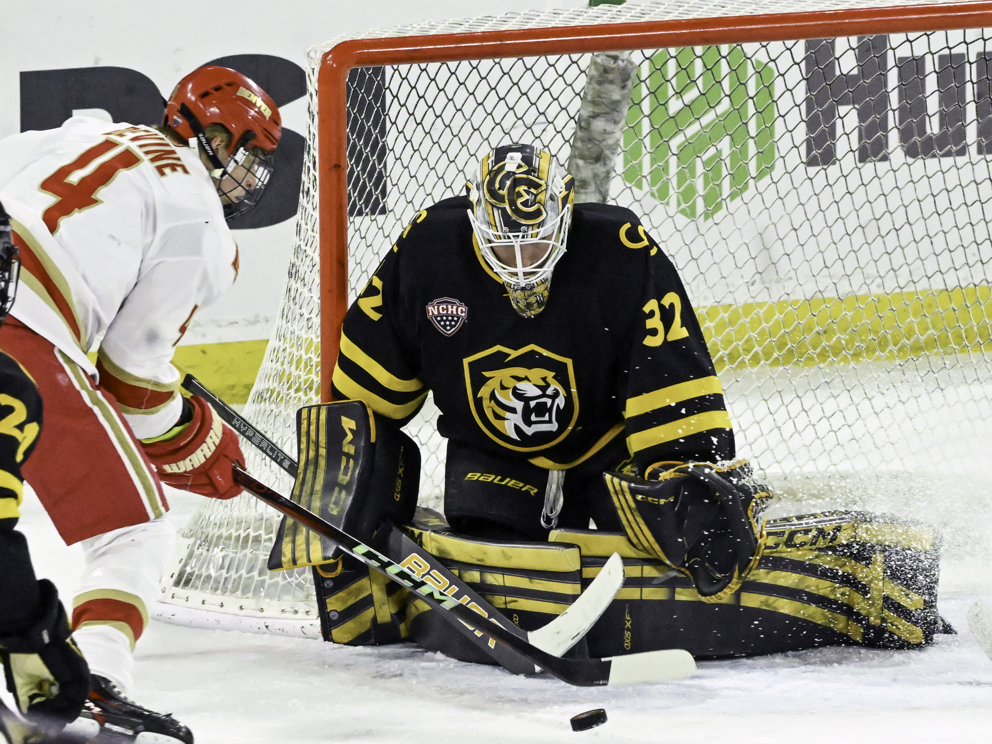 DU’s Jack Devine shoots the puck at CC goalkeeper Carsen Musserd uring a game at Magness Arena on Sunday, March 16, 2025. DU won the game 9-2. (Jerilee Bennett)