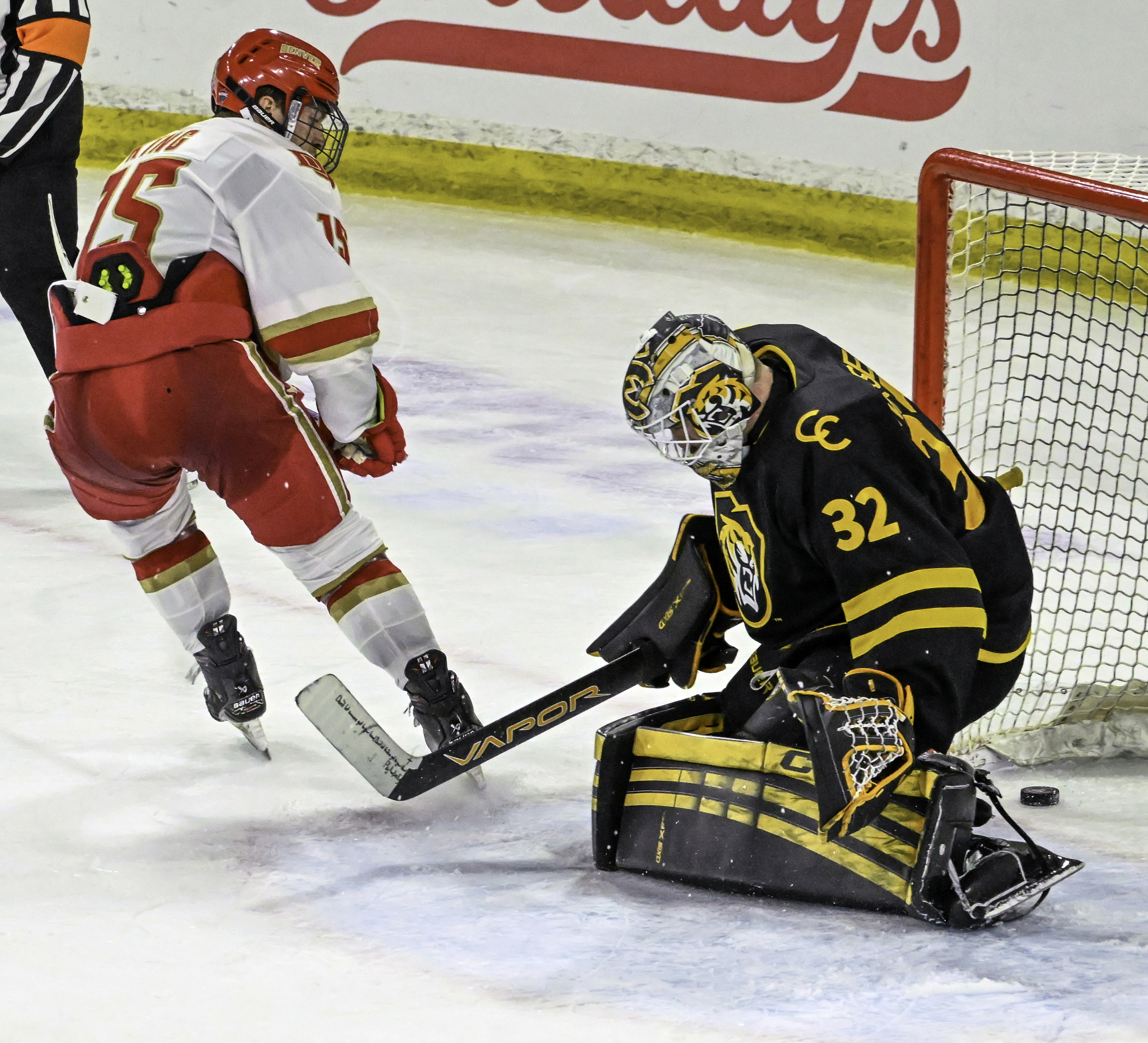 DU’s Carter King looks back to see his goal on CC goalie Carsen Musser during the first period of a game at Magness Arena in Denver on Sunday, March 16, 2025. DU ended CC’s season in game 3 of the first round of the playoffs by defeating them 9-2. (Jerilee Bennett, The Gazette)
