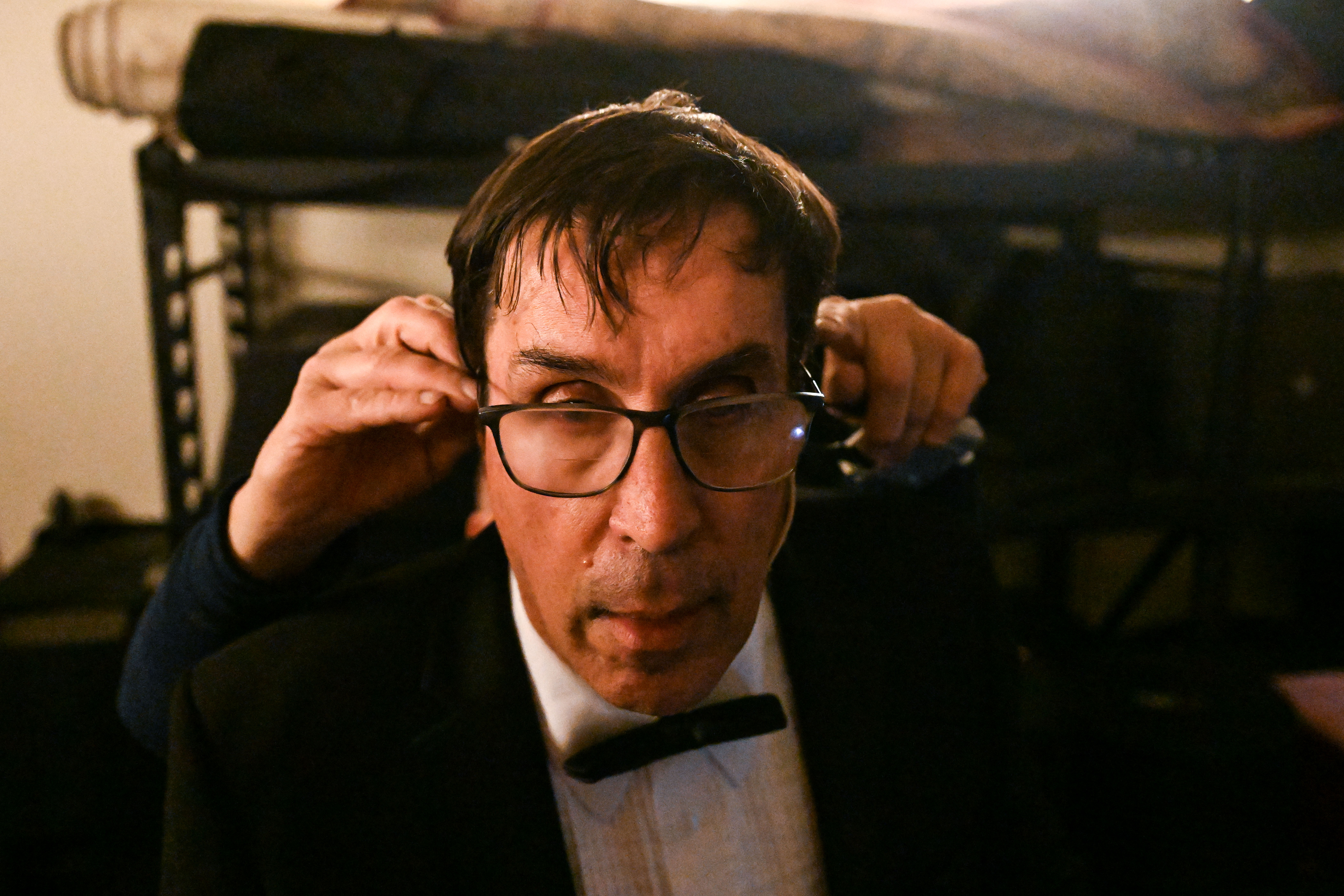 Ed Reinhardt gets his microphone put on his ears as he prepares to go on stage for a dress rehearsal during his 27th and final performance of “Magic Moments” in Englewood on Wednesday, March 26, 2025. (Stephen Swofford, Denver Gazette) (StephenSwoffordPhotographerstephen.swofford@gazette.comhttps://secure.gravatar.com/avatar/1ddcaf11c5d70eaa58546ddc4e038687?d=mm&r=g)