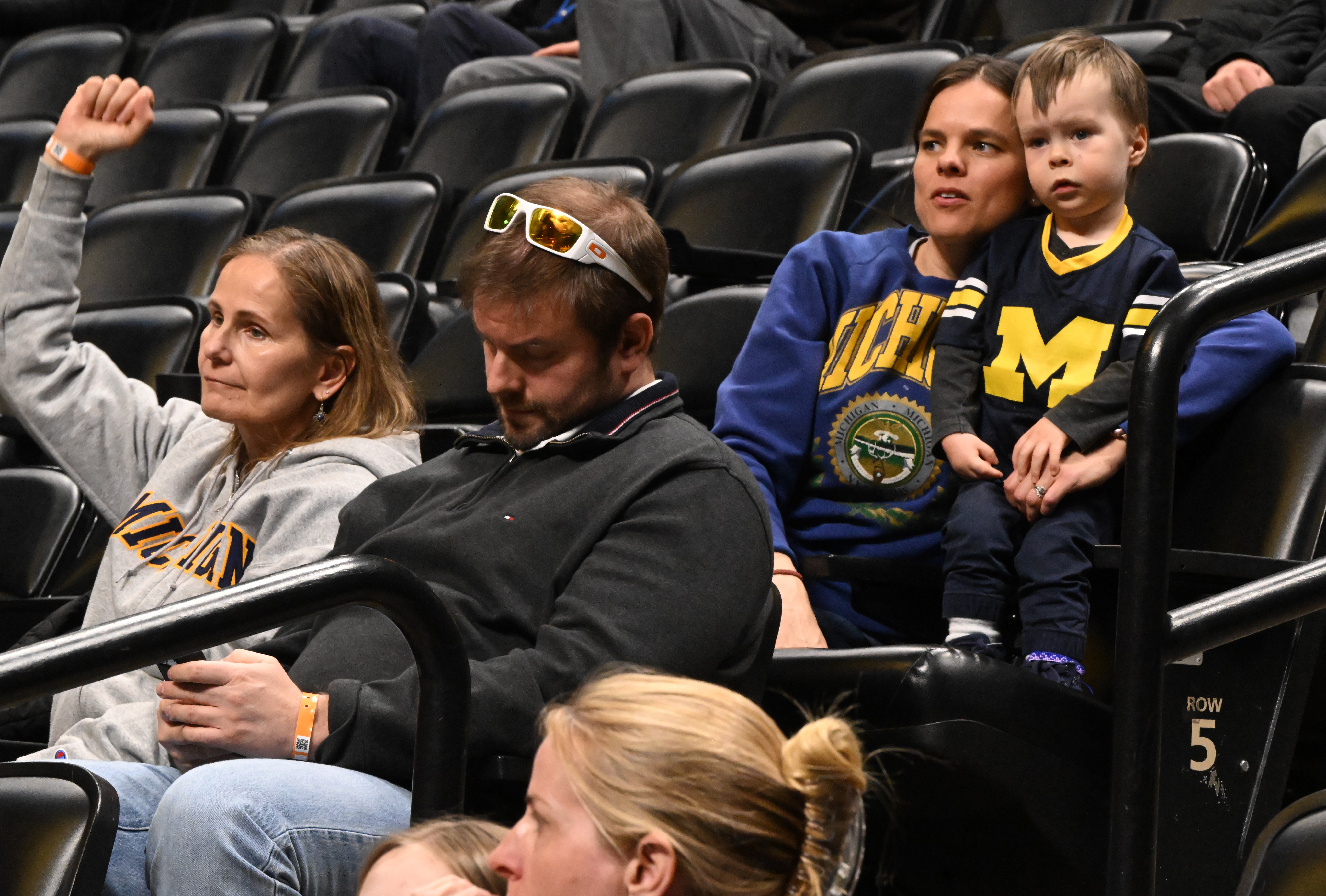 Michigan fans watch them practice from the stands during practice day on Wednesday, March 19, 2025, at Ball Arena for the NCAA March Madness tournament. The first round of the tournament starts on Thursday. (Jerilee Bennett,The Gazette)