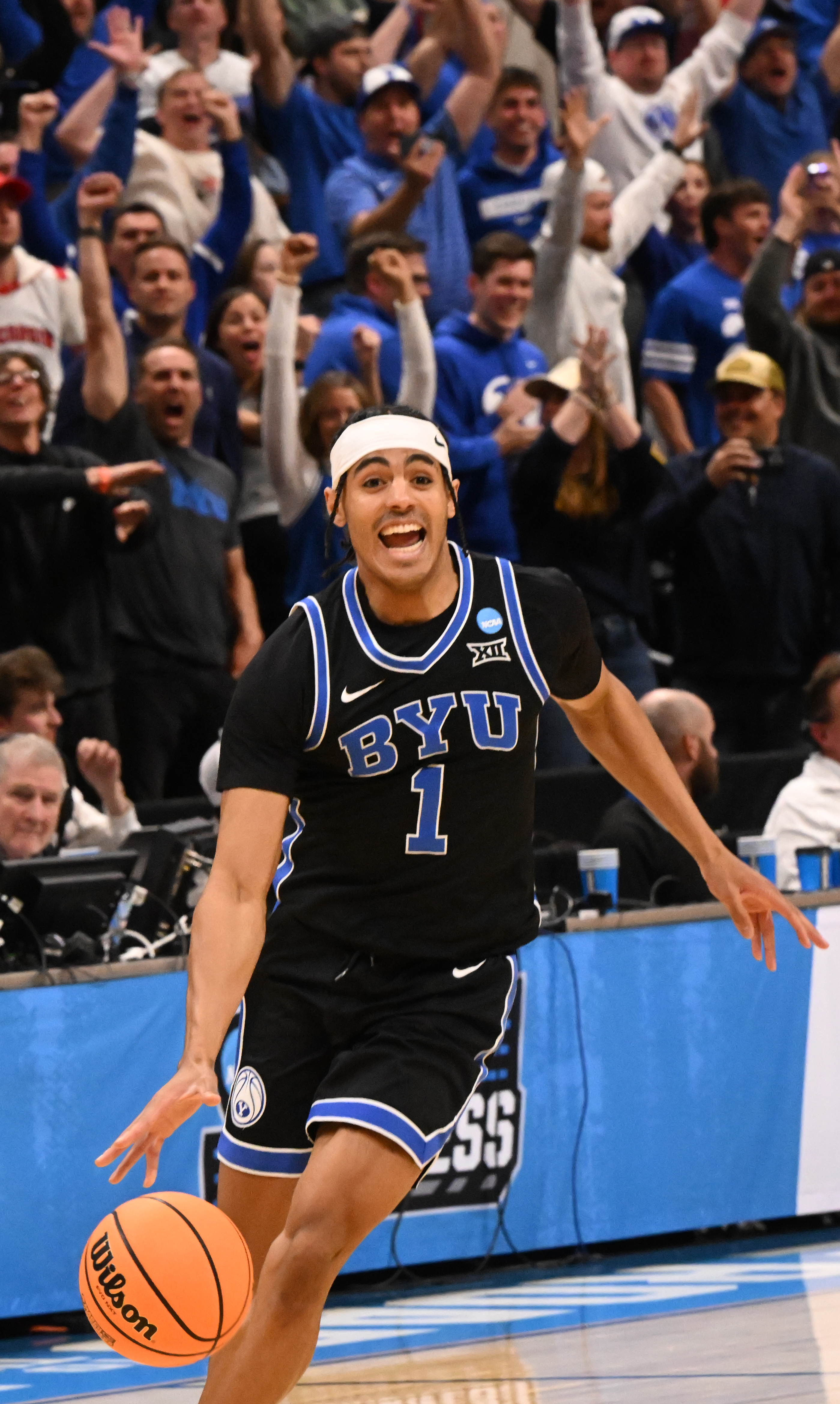Brigham Young Cougars guard Trey Stewart (1) controls the ball seconds before the final buzzer as the BYU fans go wild during the second round of March Madness at Ball Arena on Saturday, March 22, 2025. BYU defeated Wisconsin 91-89 and will be going to the Sweet Sixteen. (Jerilee Bennett,The Gazette)
