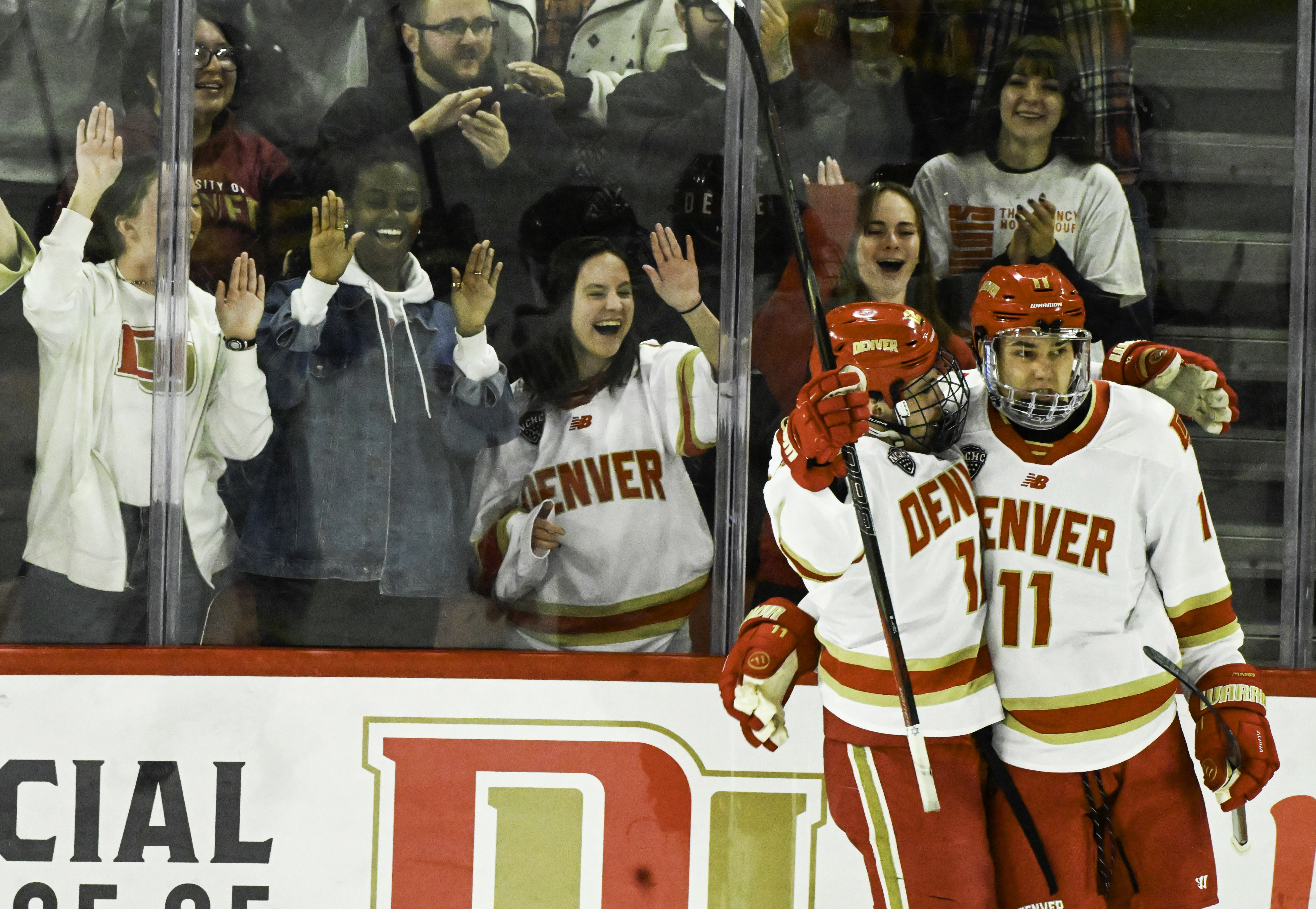 DU’s Sam Harris hugs Samu Salminen after Salminen scored the first goal against CC at Magness Arena on Sunday, March 16, 2025. DU won the game 9-2. (Jerilee Bennett)