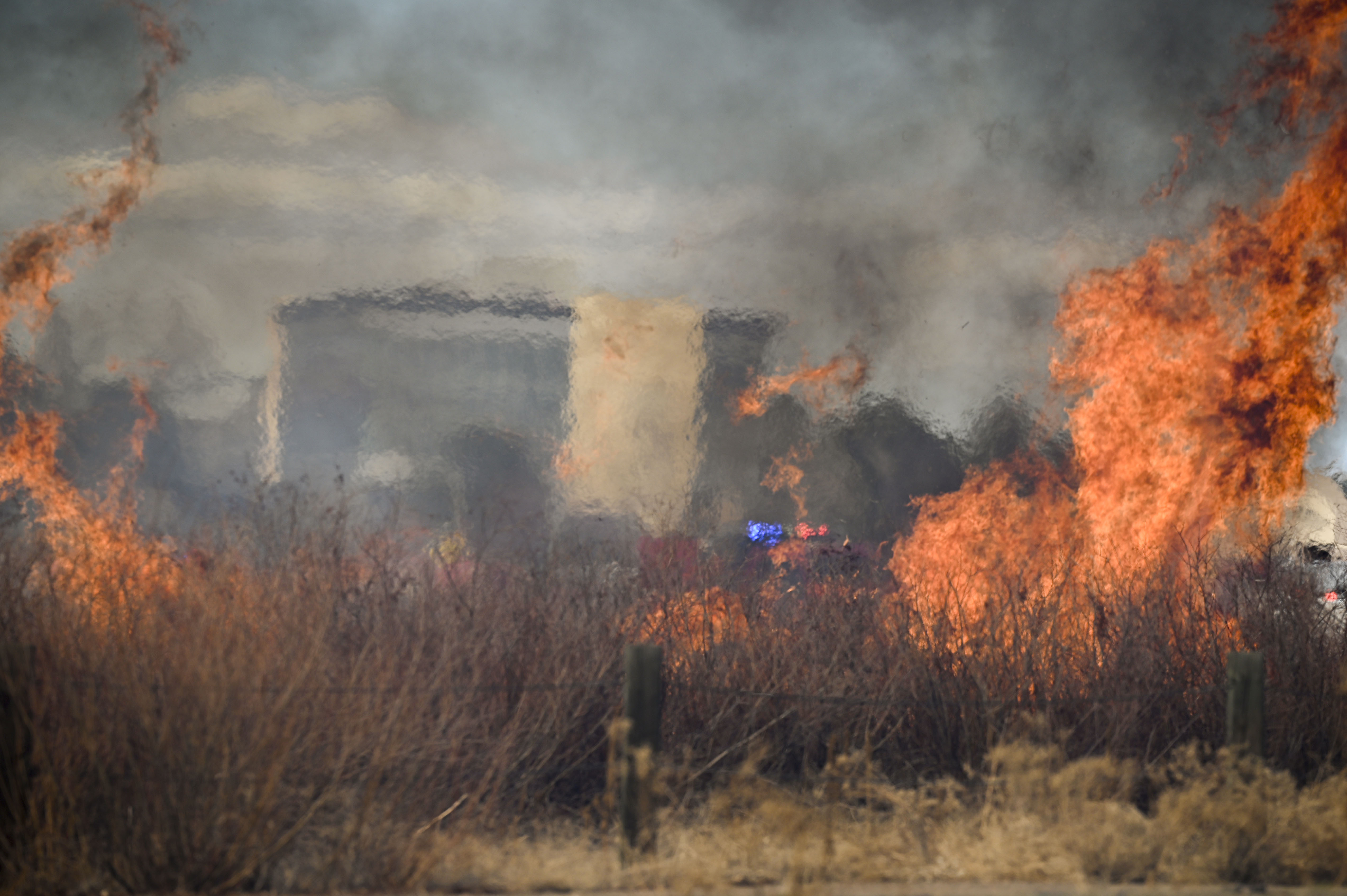 Aurora firefighters combat a wildfire at Jewell Wetlands Park in Aurora on Friday, March 21, 2025. (Stephen Swofford, Denver Gazette) (StephenSwoffordPhotographerstephen.swofford@gazette.comhttps://secure.gravatar.com/avatar/1ddcaf11c5d70eaa58546ddc4e038687?d=mm&r=g)