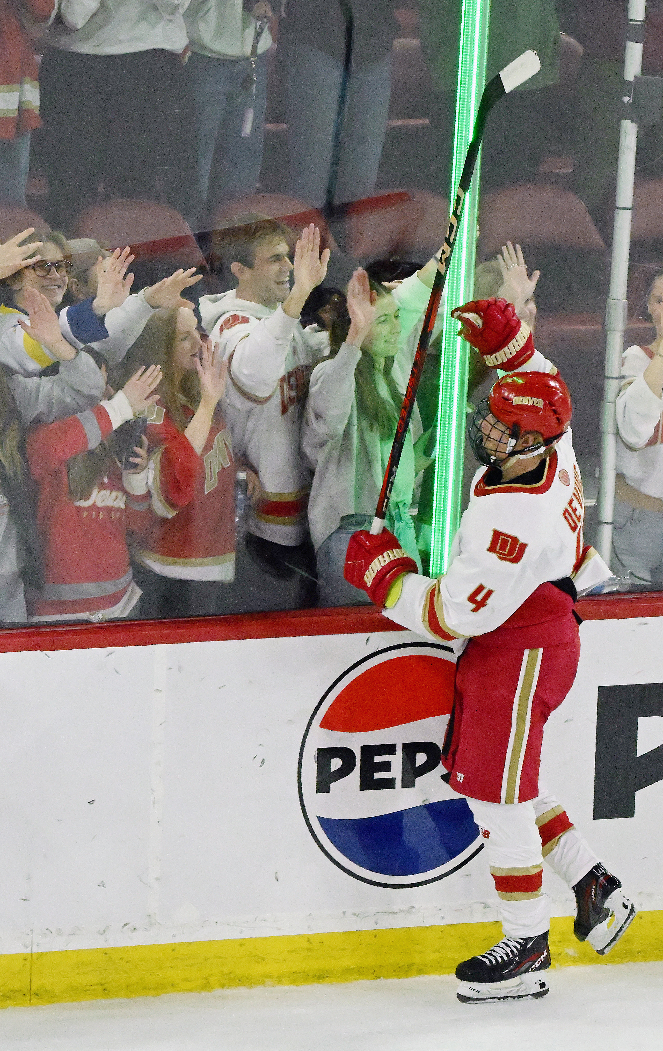 DU’s Jack Devine greets the fans after winning a game against CC at Magness Arena in Denver on Sunday, March 16, 2025. DU ended CC’s season in game 3 of the first round of the playoffs by defeating them 9-2. (Jerilee Bennett, The Gazette)