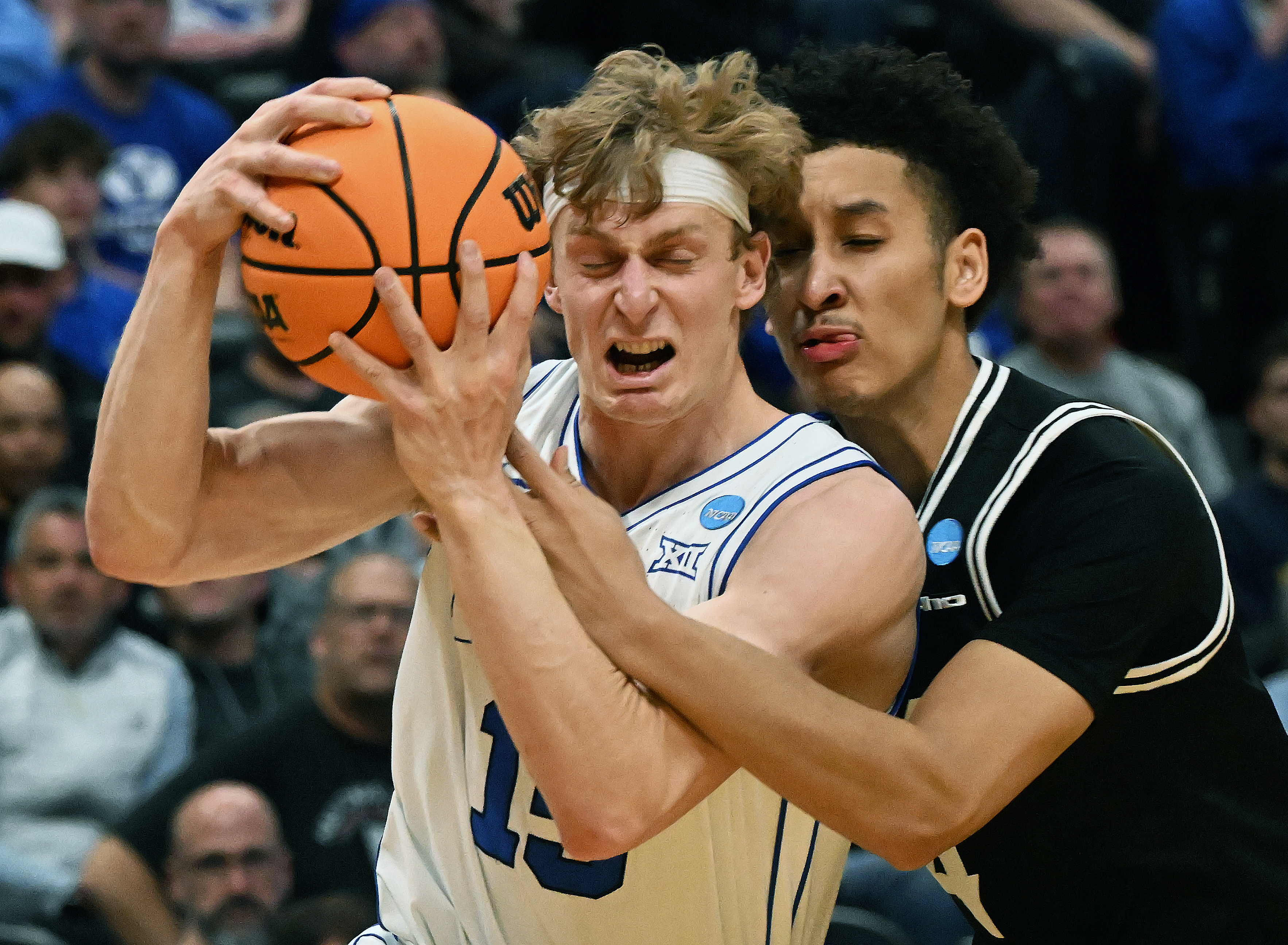 Brigham Young Cougars forward Richie Saunders (15) is pressured by Virginia Commonwealth Rams forward Jack Clark (4) during the second half of a round 1 game of the NCAA March Madness tournament at Ball Arena on Thursday, March 20, 2025. BYU defeated VCU 80-71. (Jerilee Bennett,The Gazette)