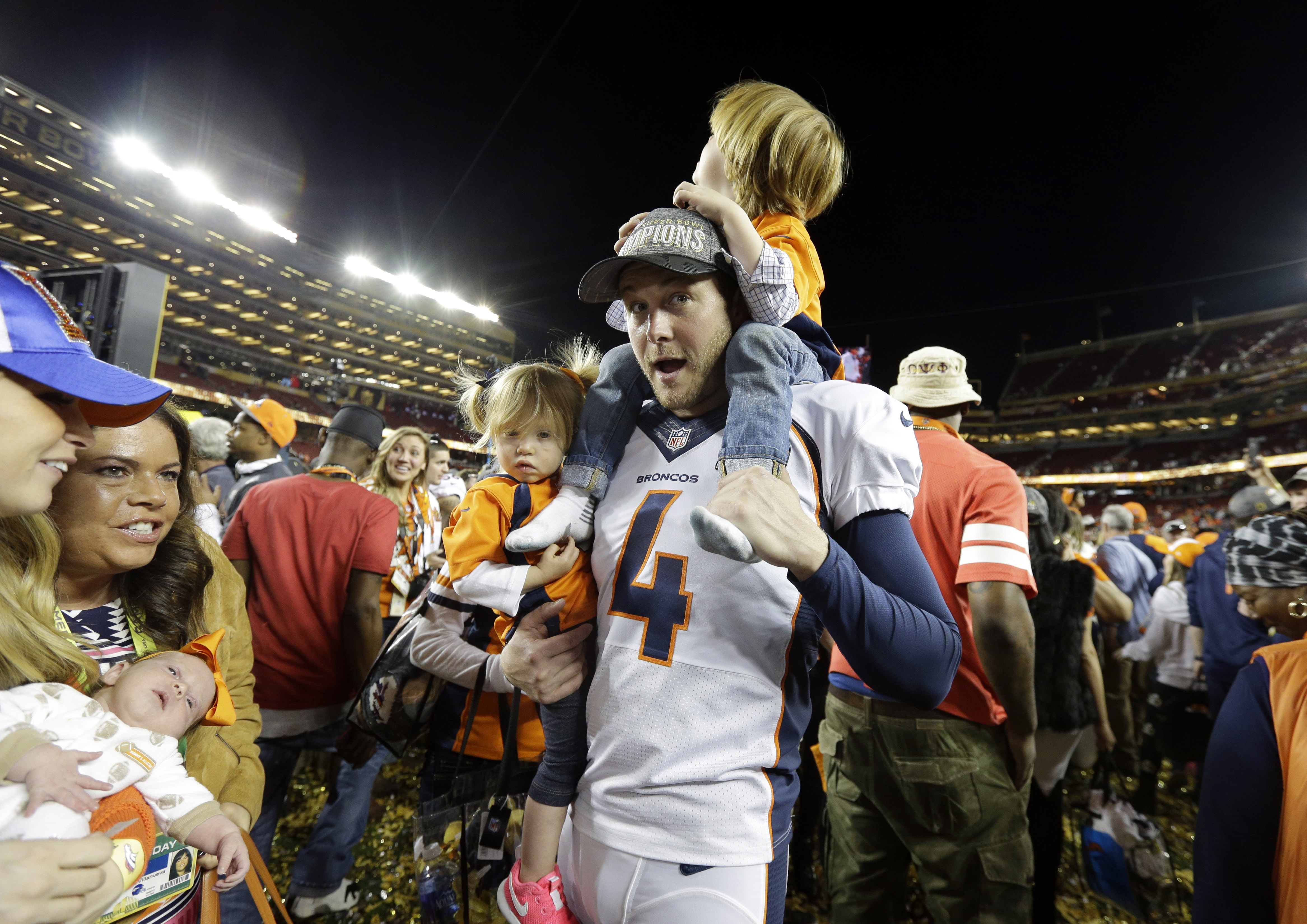 Denver Broncos’ Britton Colquitt leaves the field with his children after the NFL Super Bowl 50 football game against the Carolina Panthers, Sunday, Feb. 7, 2016, in Santa Clara, Calif. The Broncos won 24-10. (AP Photo/Julie Jacobson) (Julie Jacobson)