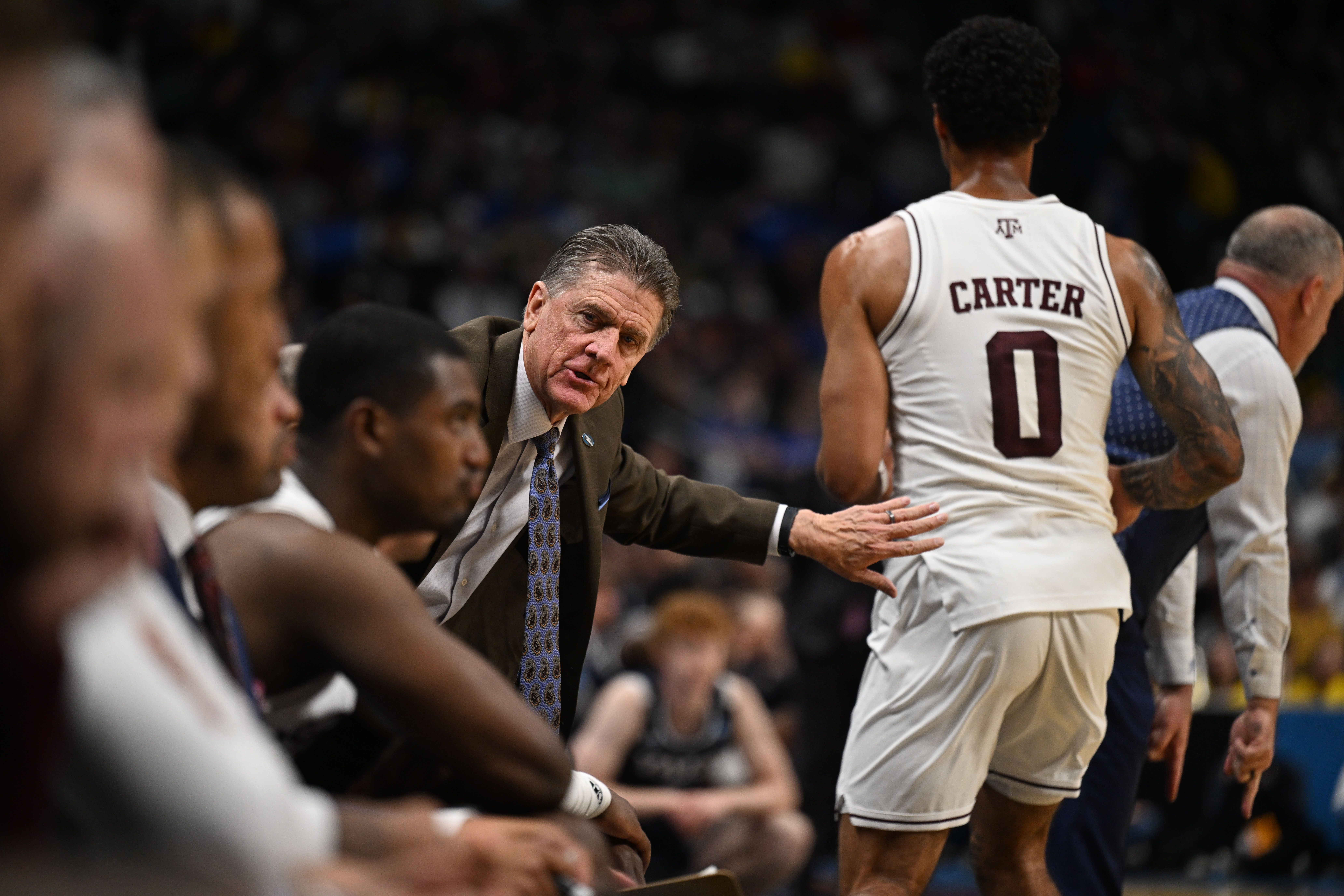 Texas A&M Aggies assistant Dale Layer watches from the sidelines in the second half of the Yale vs Texas A&M game during NCAA March Madness on Thursday, March 20, 2025. Texas won the match 80-71. (Stephen Swofford, Denver Gazette) (StephenSwoffordPhotographerstephen.swofford@gazette.comhttps://secure.gravatar.com/avatar/1ddcaf11c5d70eaa58546ddc4e038687?d=mm&r=g)