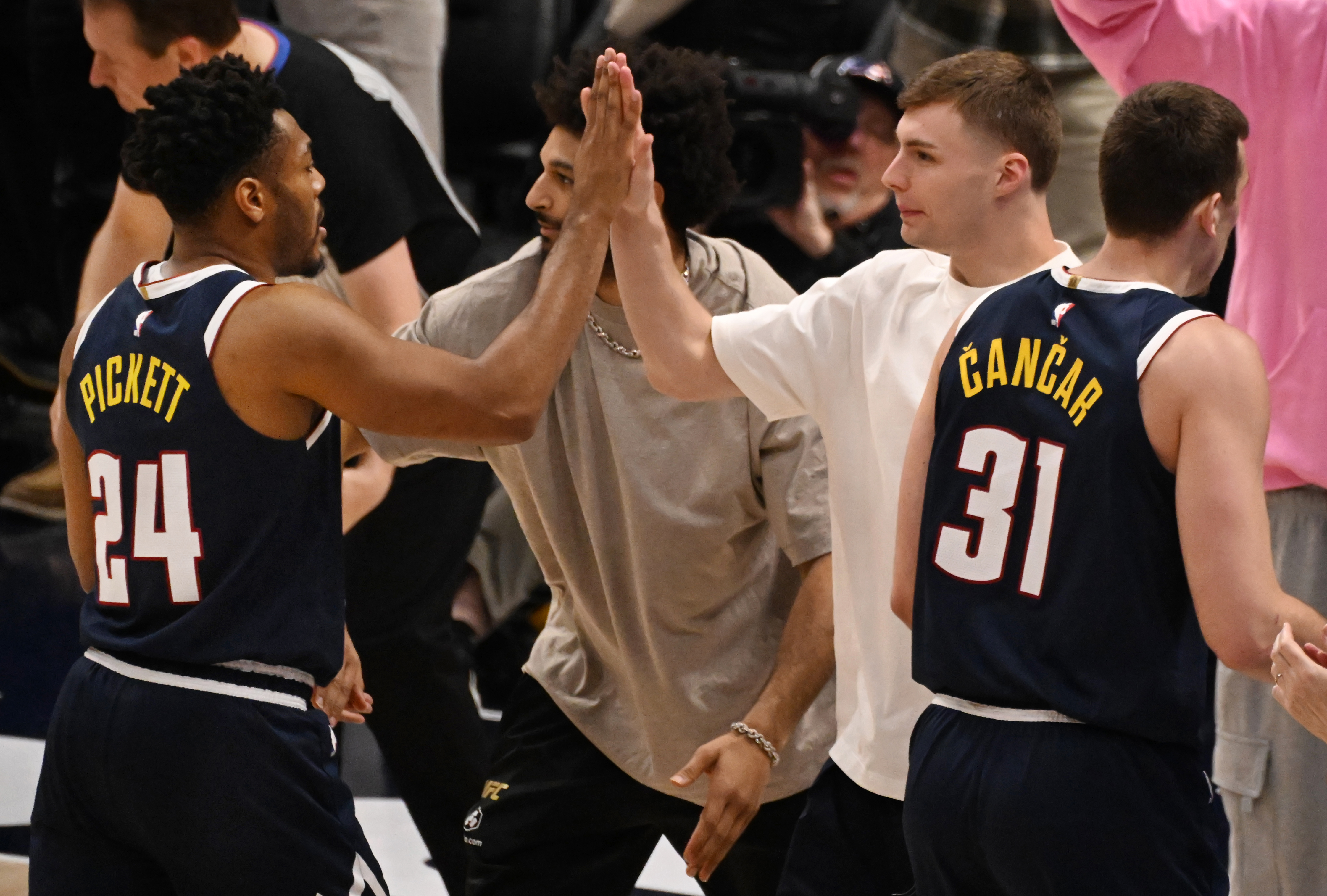 Nuggets Christian Braun high fives with Nuggets Jalen Pickett in the 3rt quarter during a game at Ball Arena on Wednesday, April 2, 2025. Most of the Nuggets starters didn’t play Wednesday night. (Jerilee Bennett,The Gazette)