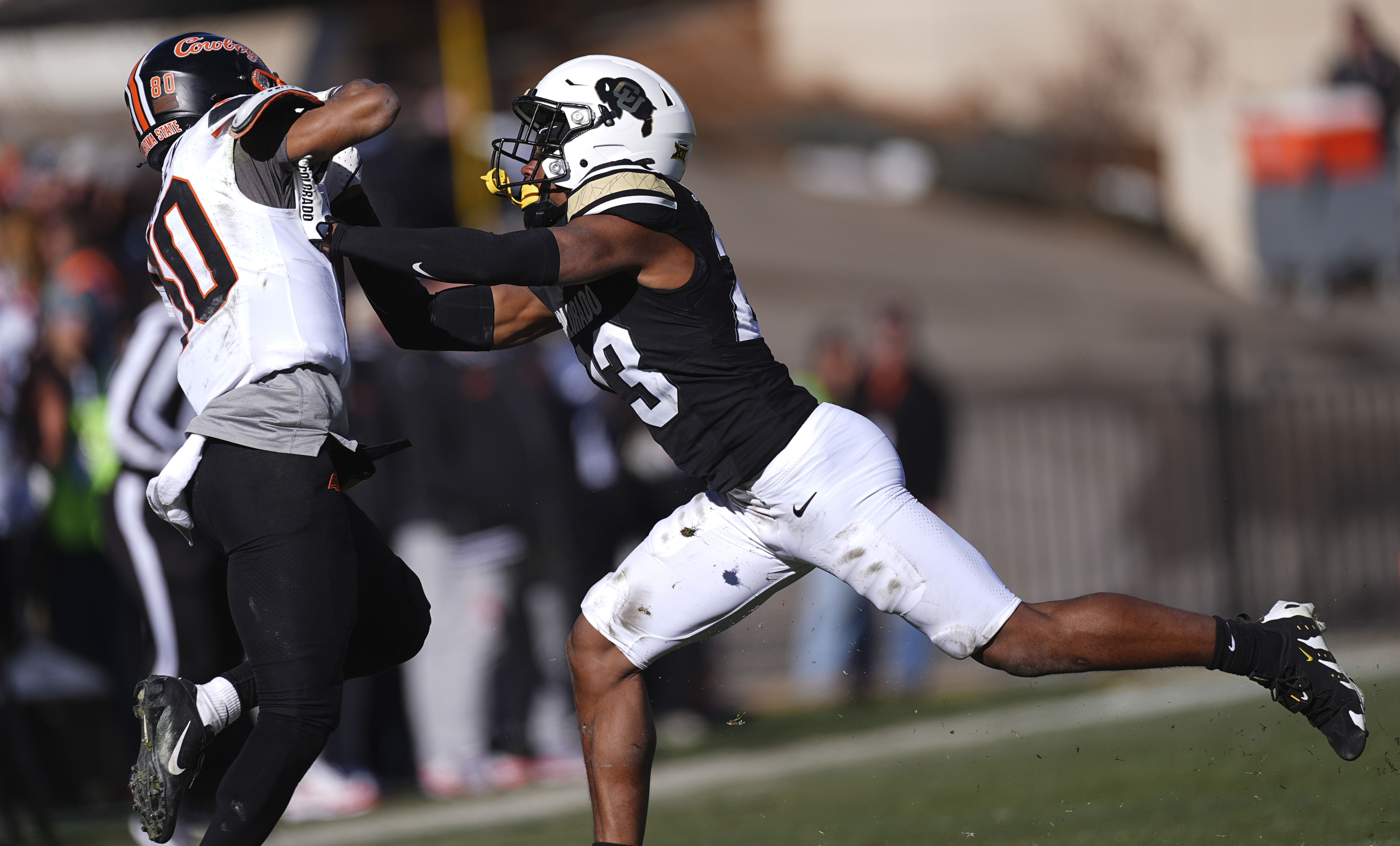 Colorado safety Carter Stoutmire (23) stops Oklahoma State wide receiver Brennan Presley (80) in the second half of an NCAA college football game Friday, Nov. 29, 2024, in Boulder, Colo. (AP Photo/David Zalubowski) (David Zalubowski)