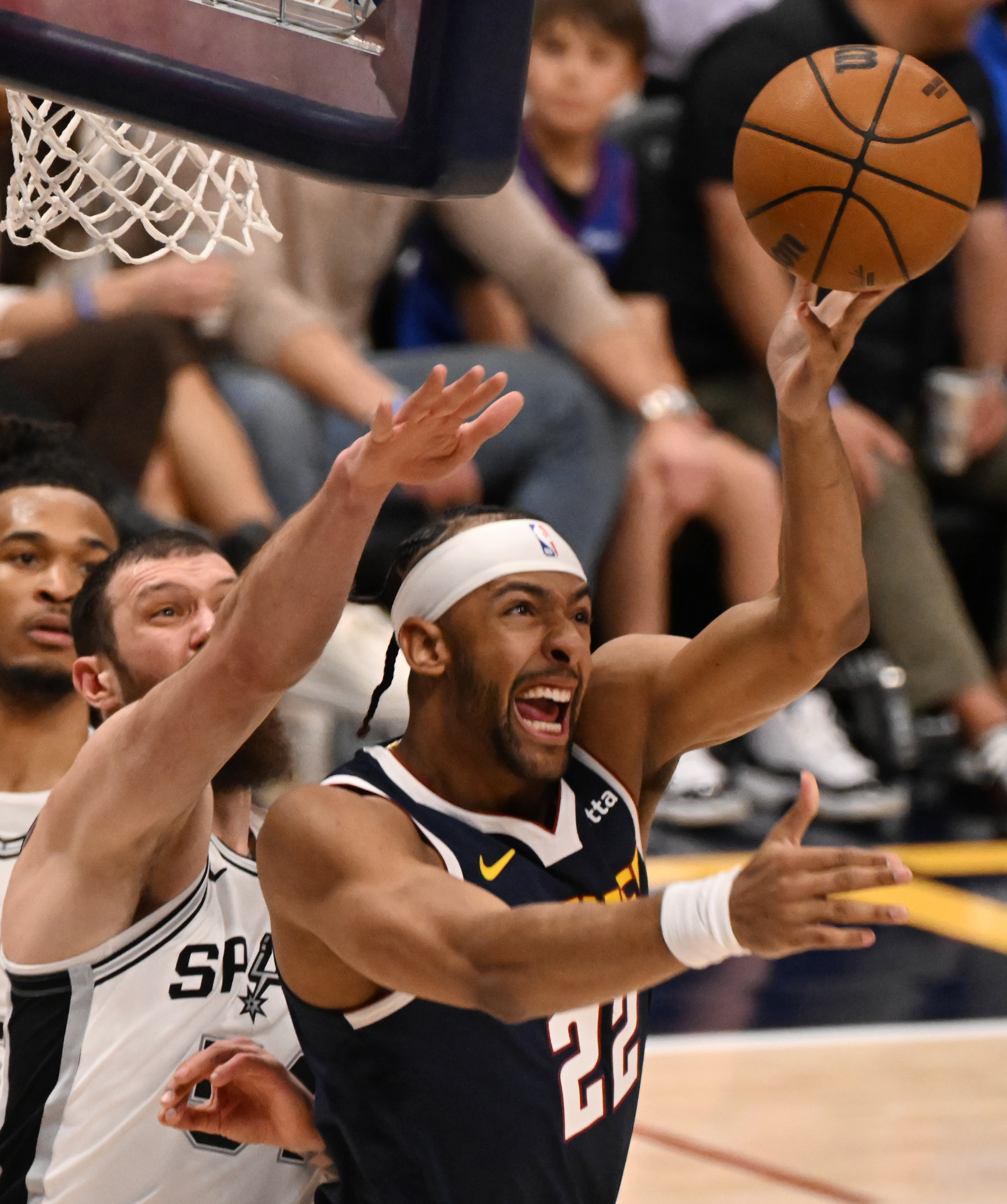 Nuggets Zeke Nnaji shoots the ball backwards into the basket in the 2nd quarter during a game against the Spurs at Ball Arena on Wednesday, April 2, 2025. (Jerilee Bennett,The Gazette)