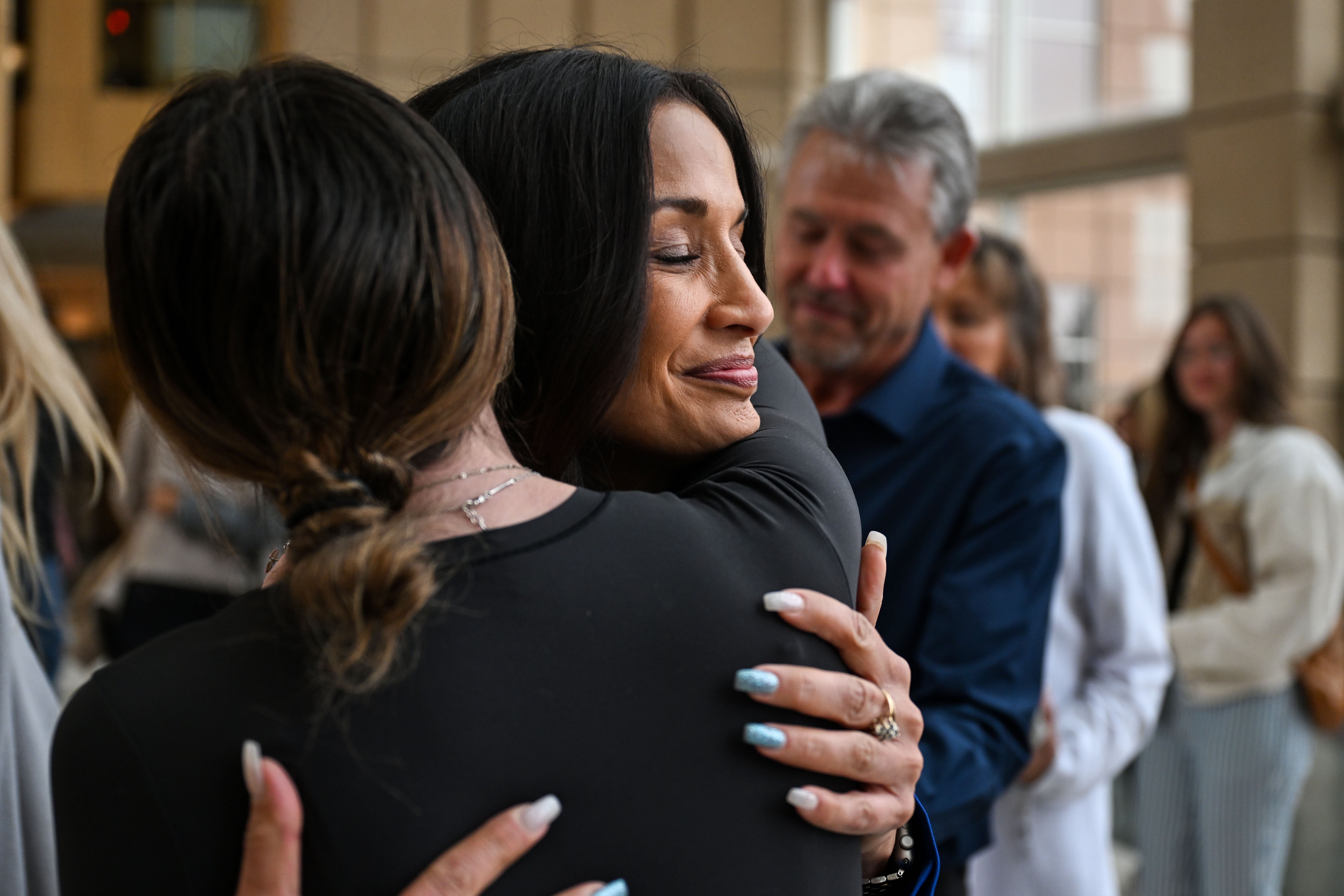 Kelly Bartell, mother of Alexa Bartell, hugs her friends and family in the lobby of the Jefferson County Courthouse after a jury found Joseph Koenig guilty of first-degree murder on Friday, April 25, 2025. Koenig faces life in prison without the possibility of parole for throwing rocks out of the window of his car, killing Alexa two years ago. (Stephen Swofford, Denver Gazette) (StephenSwoffordPhotographerstephen.swofford@gazette.comhttps://secure.gravatar.com/avatar/1ddcaf11c5d70eaa58546ddc4e038687?d=mm&r=g)