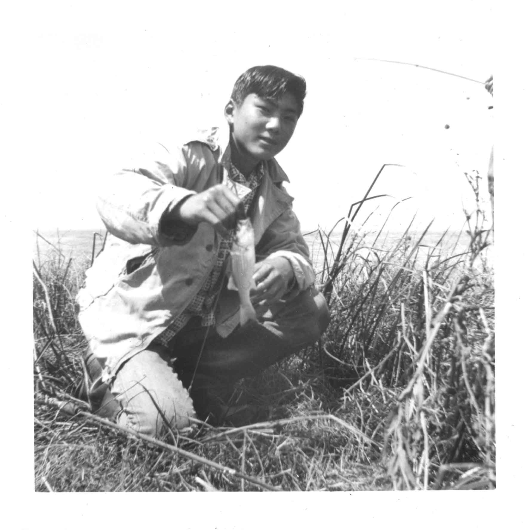 Former longtime Colorado State University professor and researcher Doug Ishii pictured fishing as a teenager. He died April13, 2025 at the age of 83. (Courtesy photo, the Ishii family)