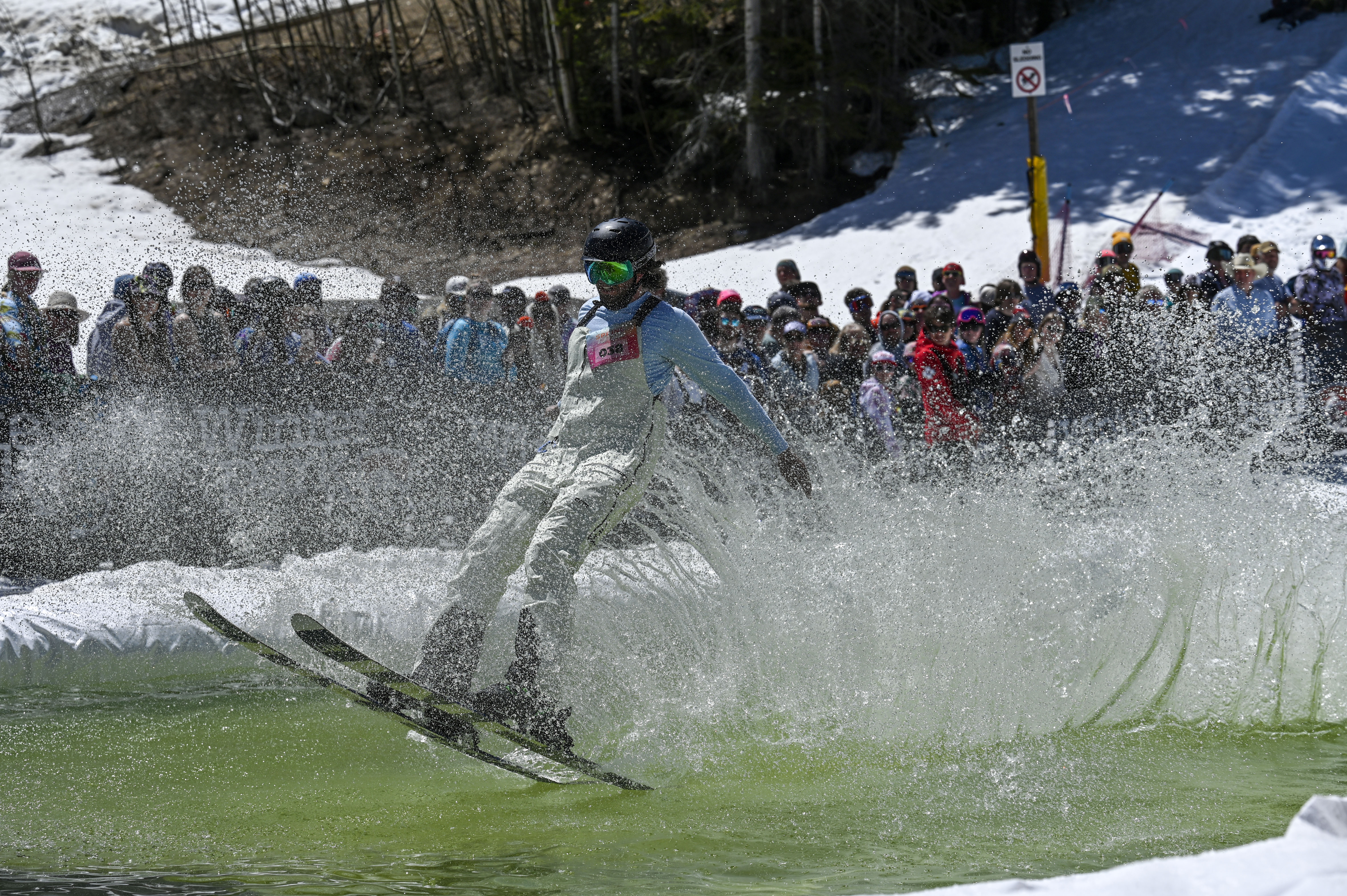 A competitor skis across a pool of water at the base of Winter Park during the Spring Splash event to celebrate the last day of the season on Sunday, April 27, 2025 (Stephen Swofford, Denver Gazette) (Stephen Swofford/ Denver Gazette)
