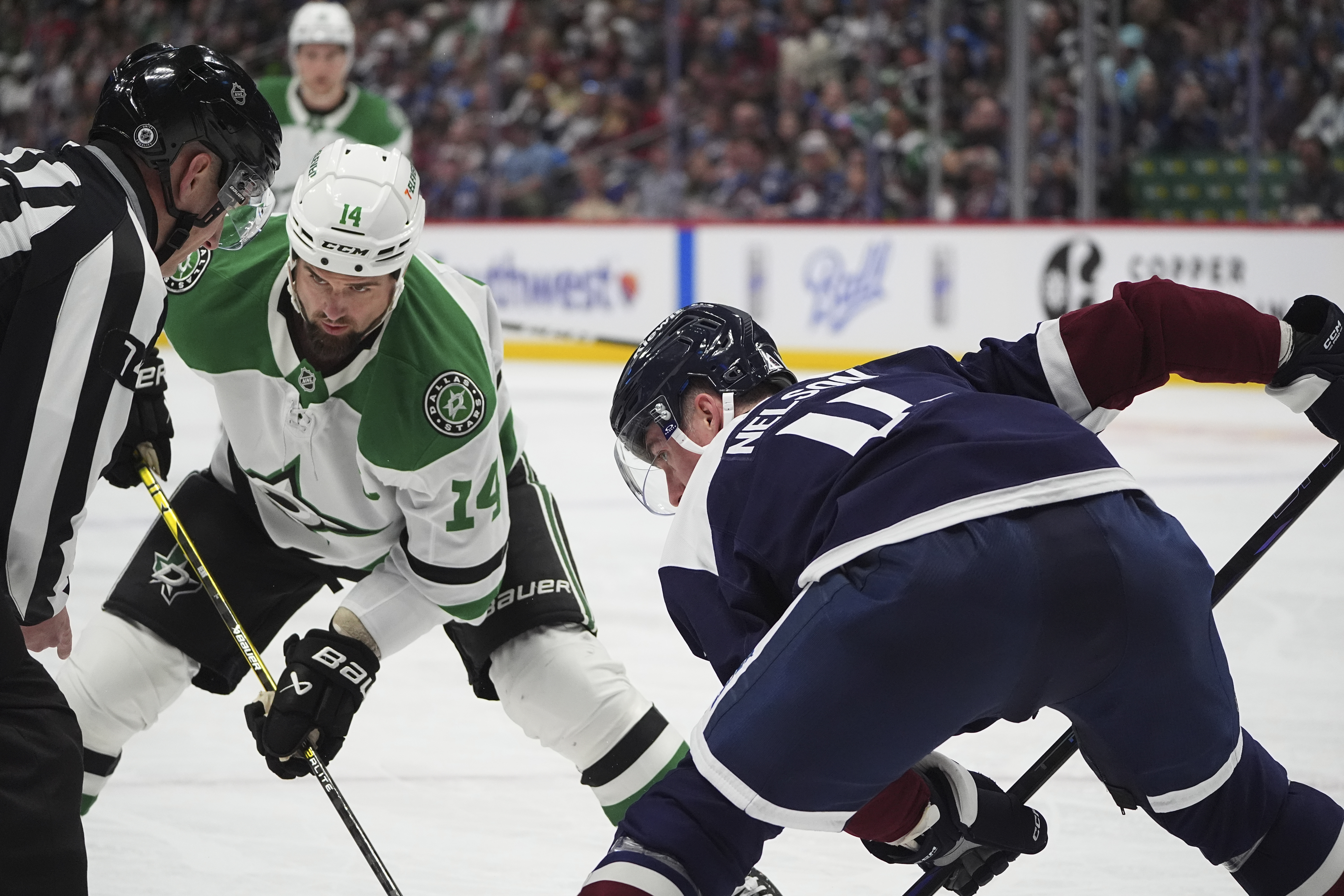Dallas Stars left wing Jamie Benn (14) and Colorado Avalanche center Brock Nelson (11) in the second period of an NHL hockey game Sunday, March 16, 2025, in Denver. (AP Photo/David Zalubowski) (David Zalubowski)