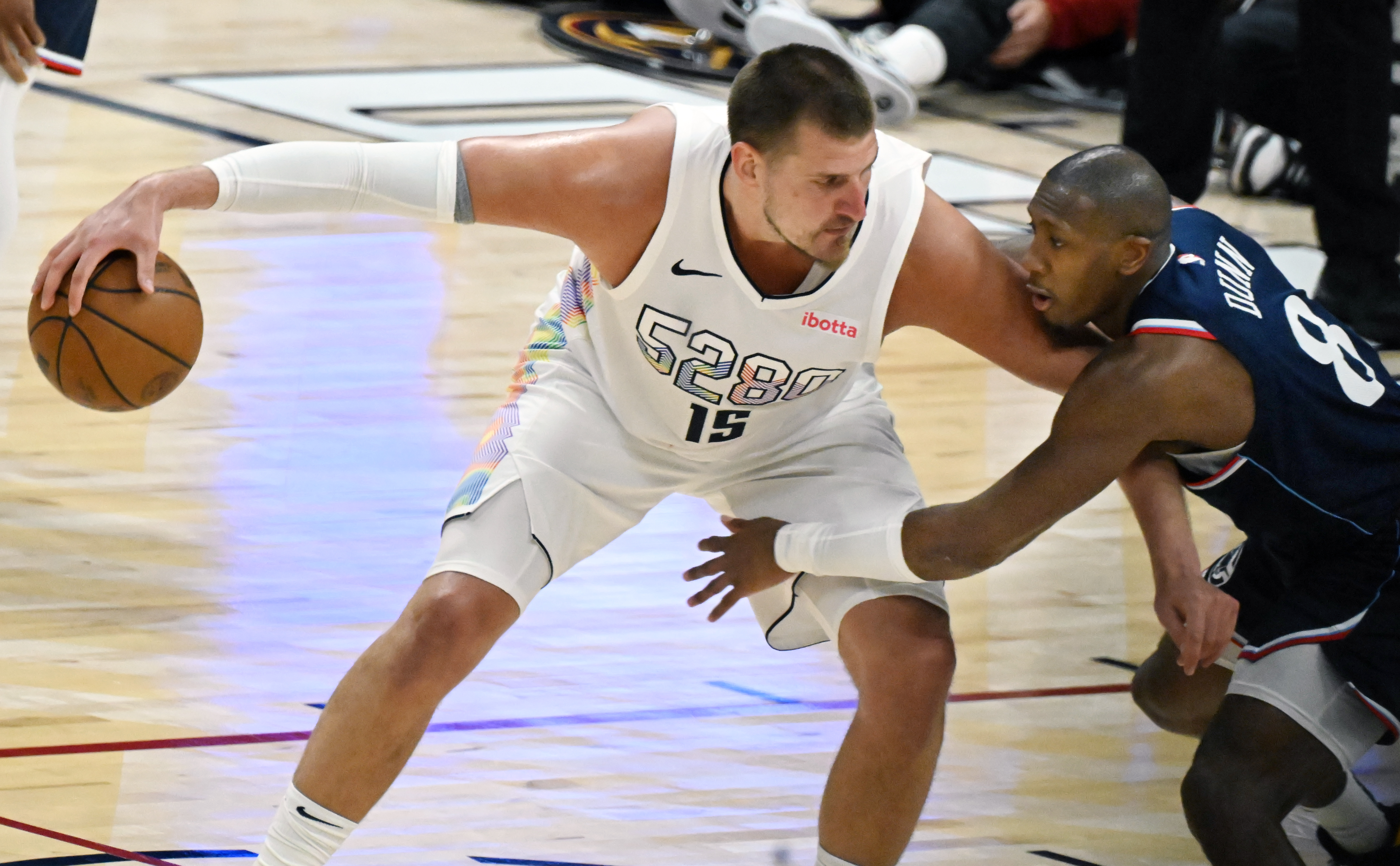 Denver Nuggets center Nikola Jokic (15) doesn’t have any trouble keeping the ball from LA Clippers guard Kris Dunn (8) during the 3rd quarter of game 5 of the first round of the Western Championships at Ball Arena on Tuesday, April 29, 2025. (Jerilee Bennett,The Gazette)
