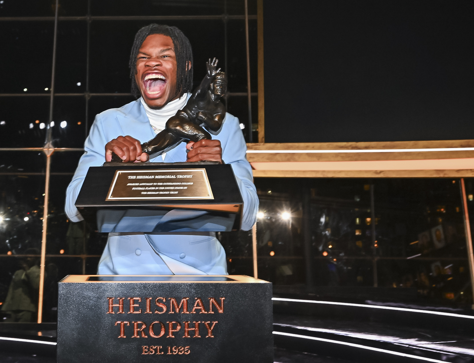 Colorado’s Travis Hunter poses with the trophy after winning the Heisman Trophy as the outstanding player in college football, Saturday, Dec. 14, 2024, in New York.(Todd Van Emst/Heisman Trust via AP, Pool) (Todd Van Emst)