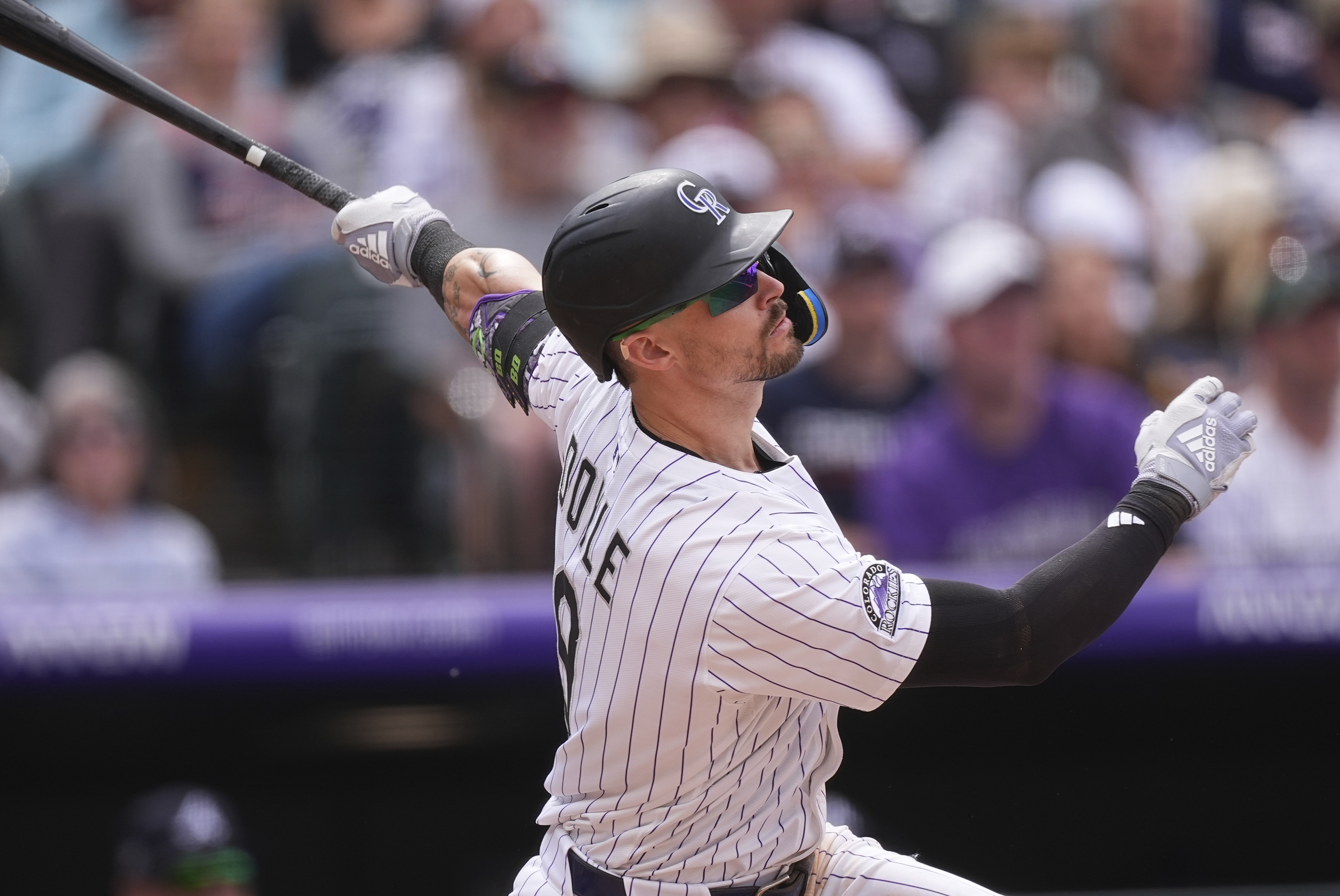 Colorado Rockies' Brenton Doyle flies out Wednesday against the Atlanta Braves to end the eighth inning in Denver. (The Associated Press)
