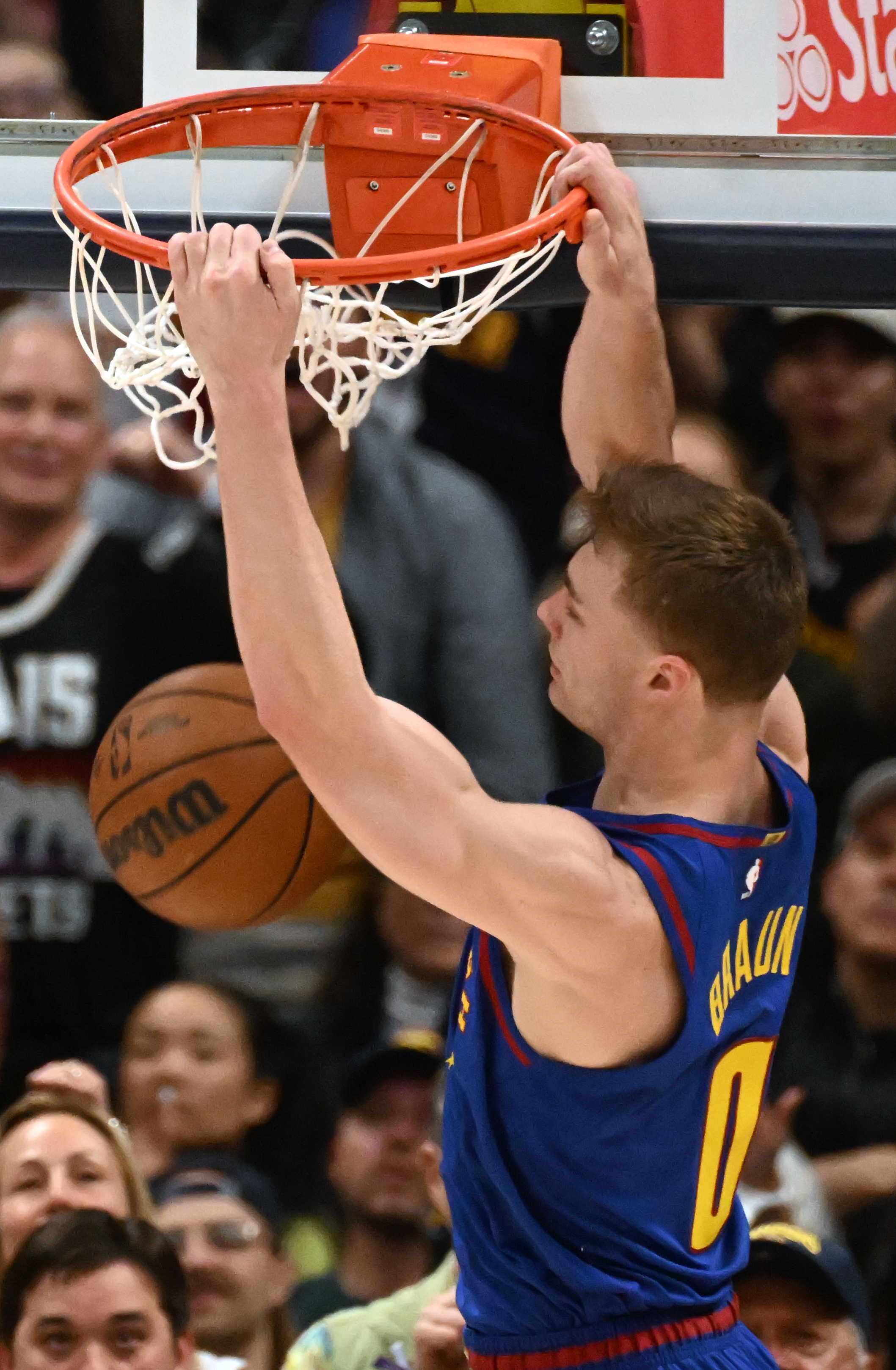 Nuggets Christian Braun dunks the ball in the first quarter of the first series of the NBA playoffs at Ball Arena on Saturday, April 19, 2025. The Nuggets won the game in overtime 112-110. (Jerilee Bennett,The Gazette)