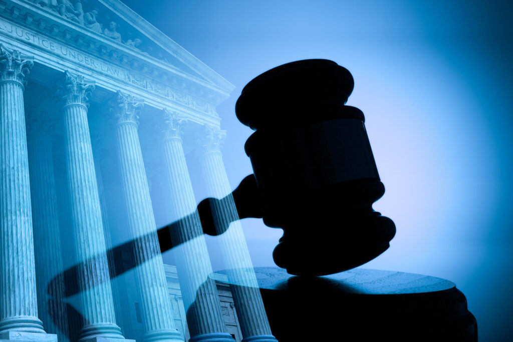 A gavel and the United States Supreme Court building. (DNY59)