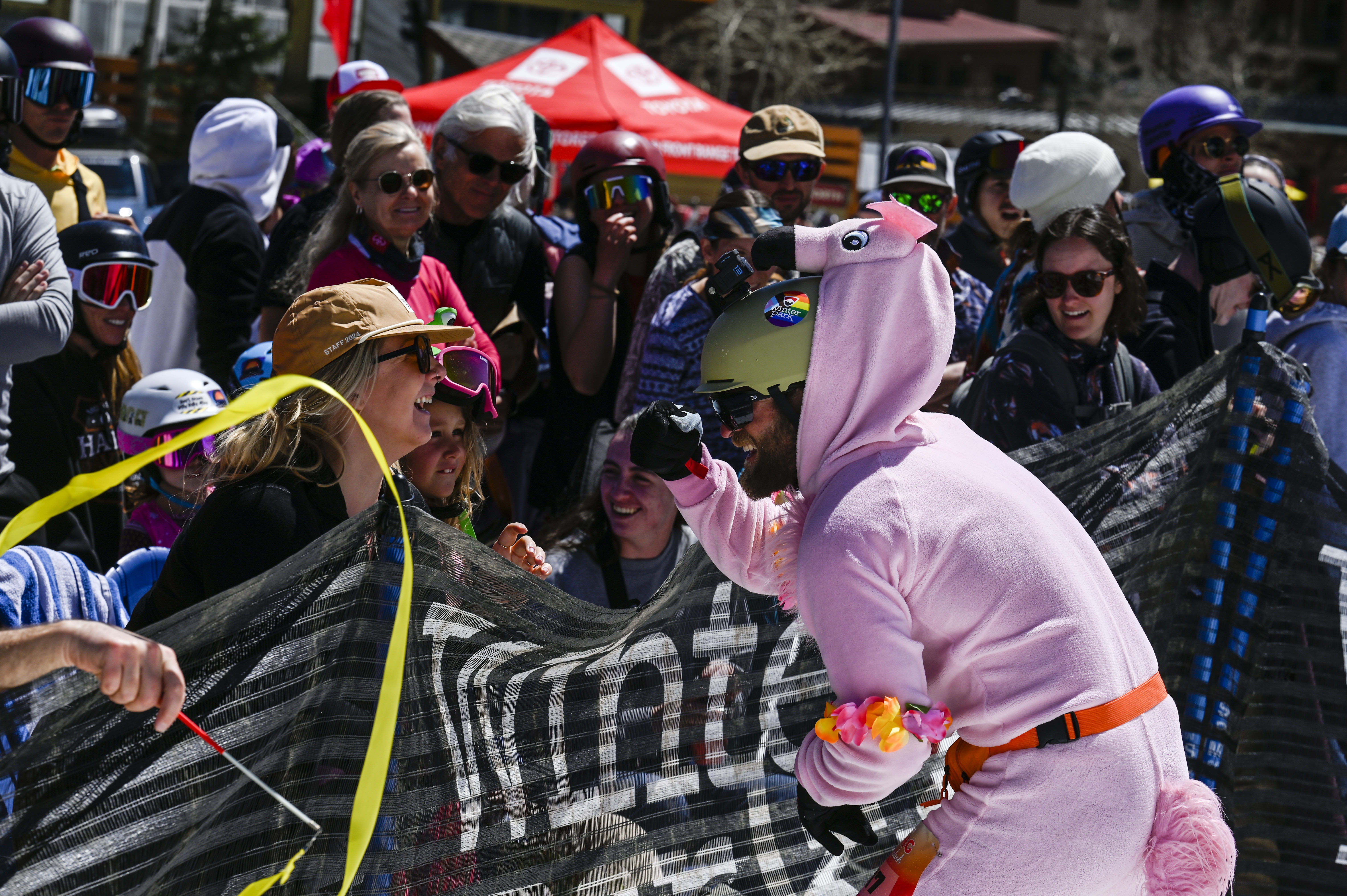 John Bohlinger fist bumps his friends and family after successfully skiing across a pool of water at the base of Winter Park during the Spring Splash event to celebrate the last day of the season on Sunday, April 27, 2025 (Stephen Swofford, Denver Gazette) (StephenSwoffordPhotographerstephen.swofford@gazette.comhttps://secure.gravatar.com/avatar/1ddcaf11c5d70eaa58546ddc4e038687?d=mm&r=g)