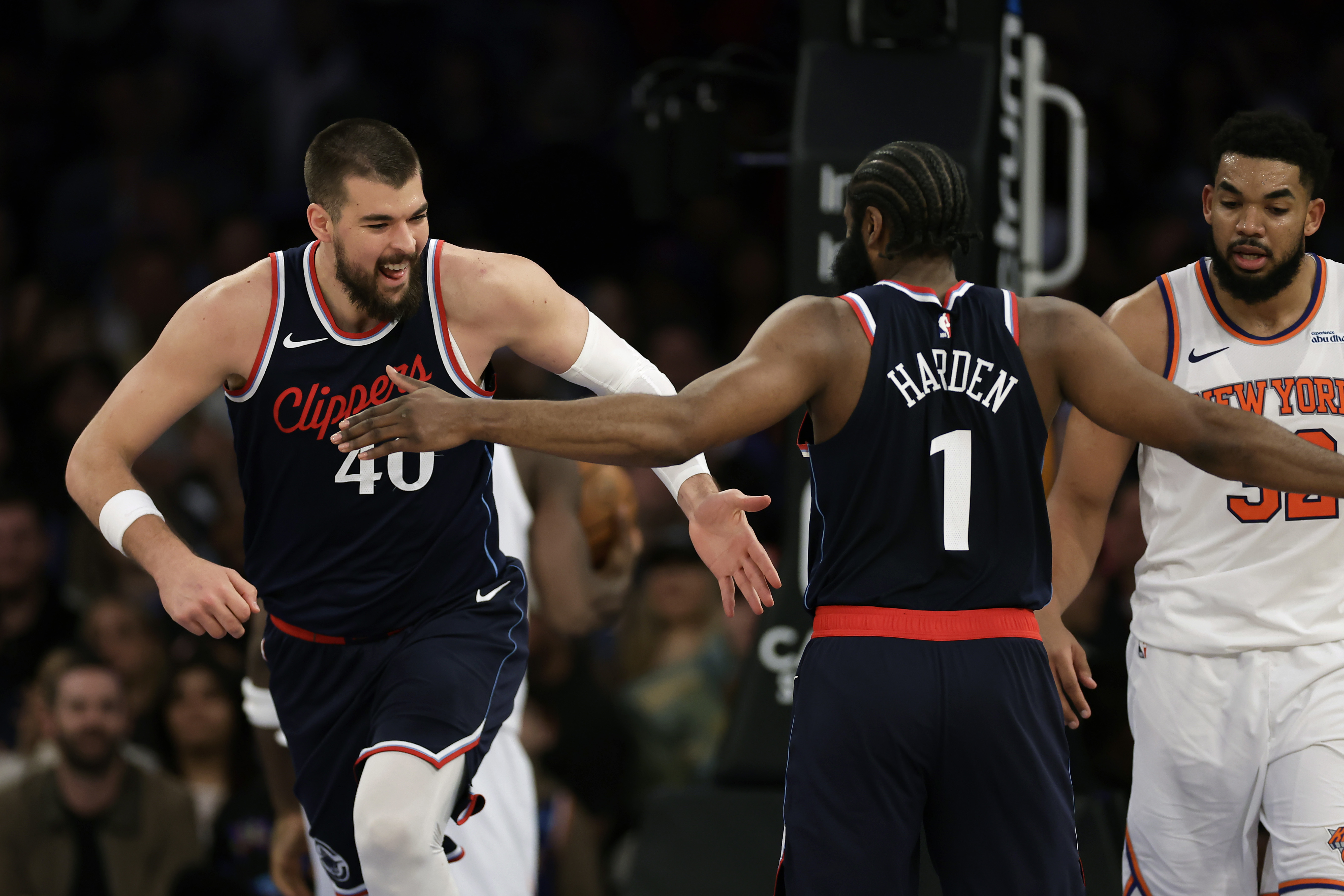 LA Clippers center Ivica Zubac (40) reacts with James Harden after making a basket in front of New York Knicks center Karl-Anthony Towns during the second half of an NBA basketball game Wednesday, March 26, 2025, in New York. (AP Photo/Adam Hunger) (Adam Hunger)