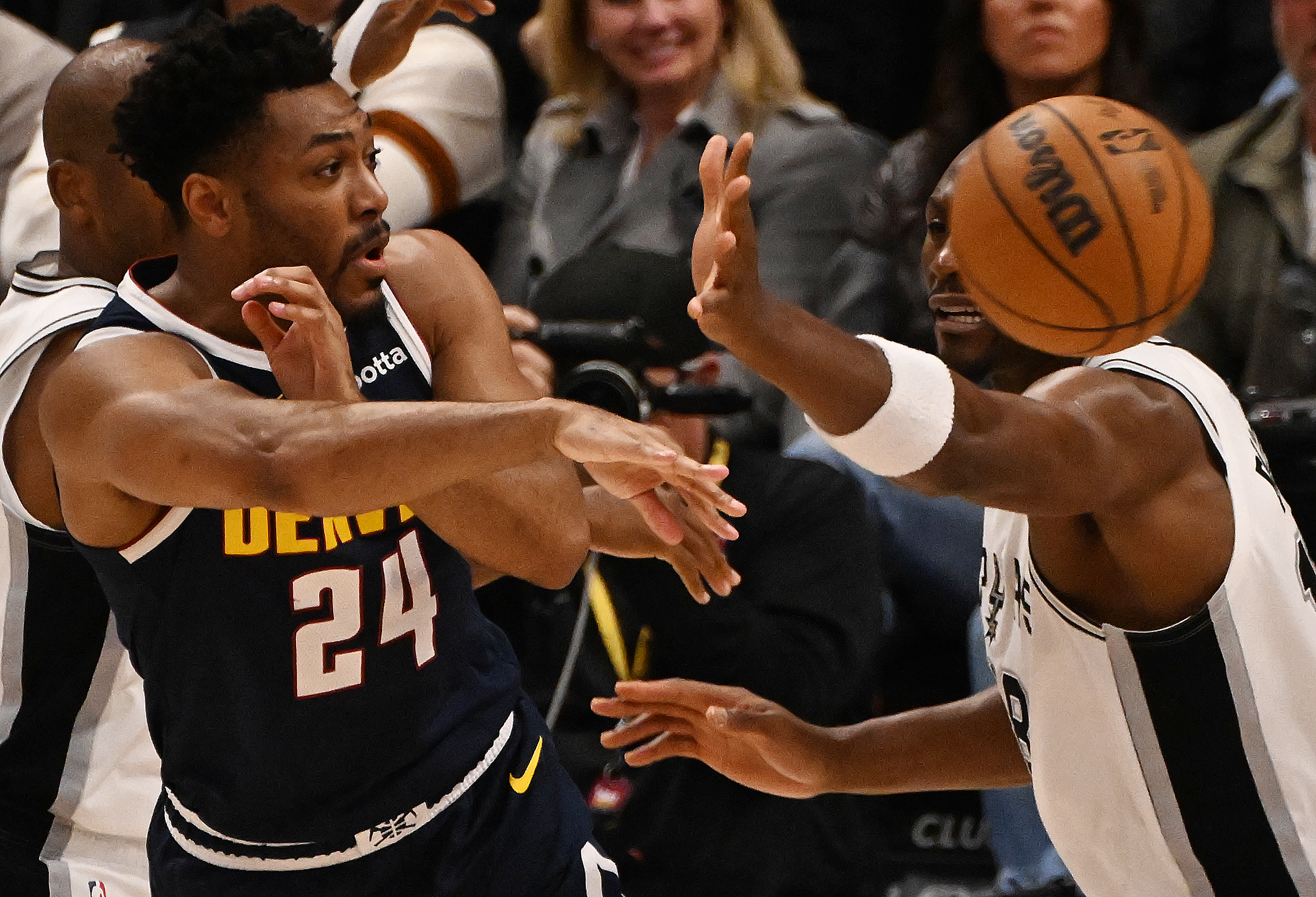 Nuggets Jalen Pickett passes the ball past ismack Biyombo in the 4th quarter during a game at Ball Arena on Wednesday, April 2, 2025. (Jerilee Bennett,The Gazette)