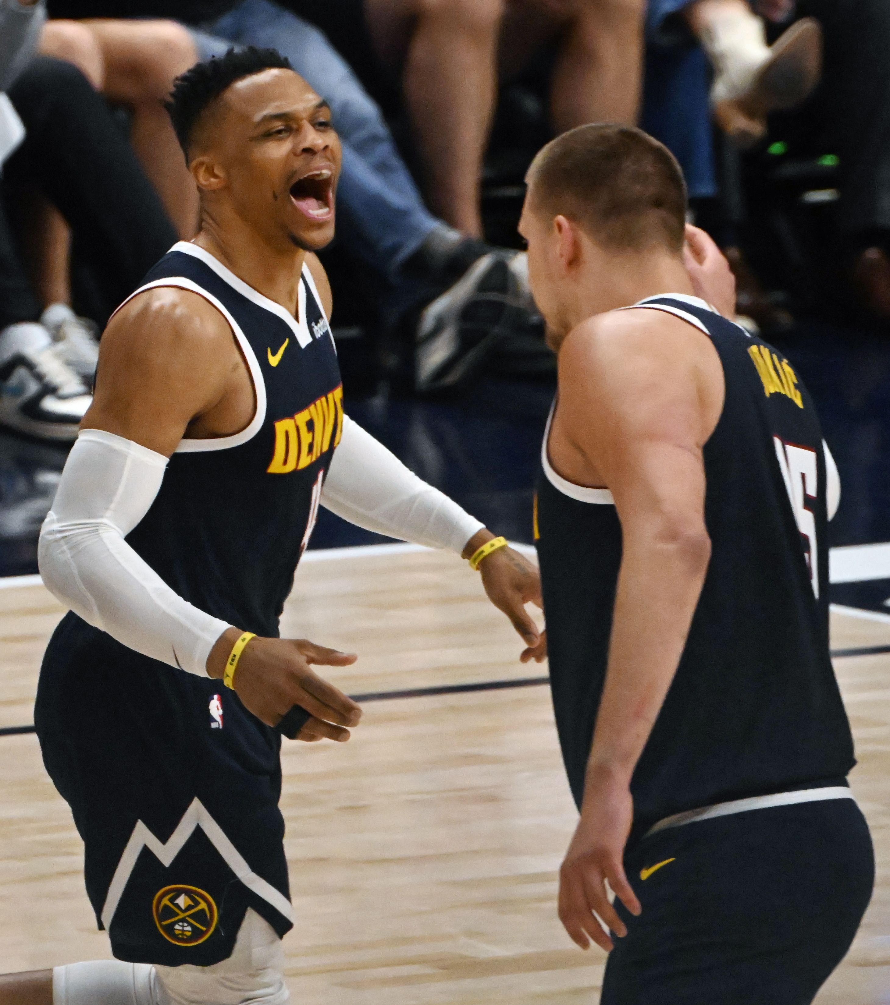 Denver Nuggets guard Russell Westbrook (4) celebrates a three-pointer with Denver Nuggets center Nikola Jokic (15) during 2nd quarter of game 2 of Round 1 of the NBA Western Championship at Ball Arena on Monday, April 21, 2025. (Jerilee Bennett,The Gazette)