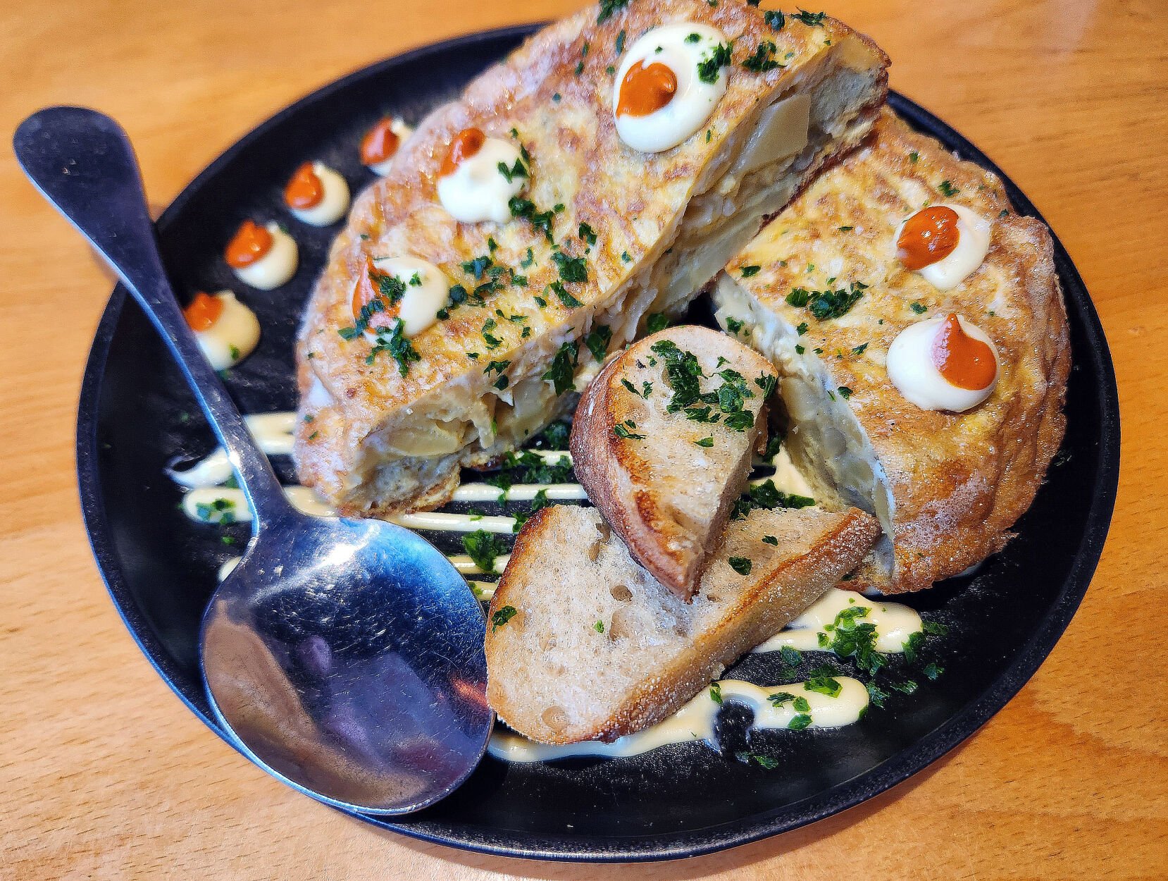 Traditional, puffy Spanish omelet with onion and potatoes at The 9th Door in Denver. Robin Intemann/ The Gazette