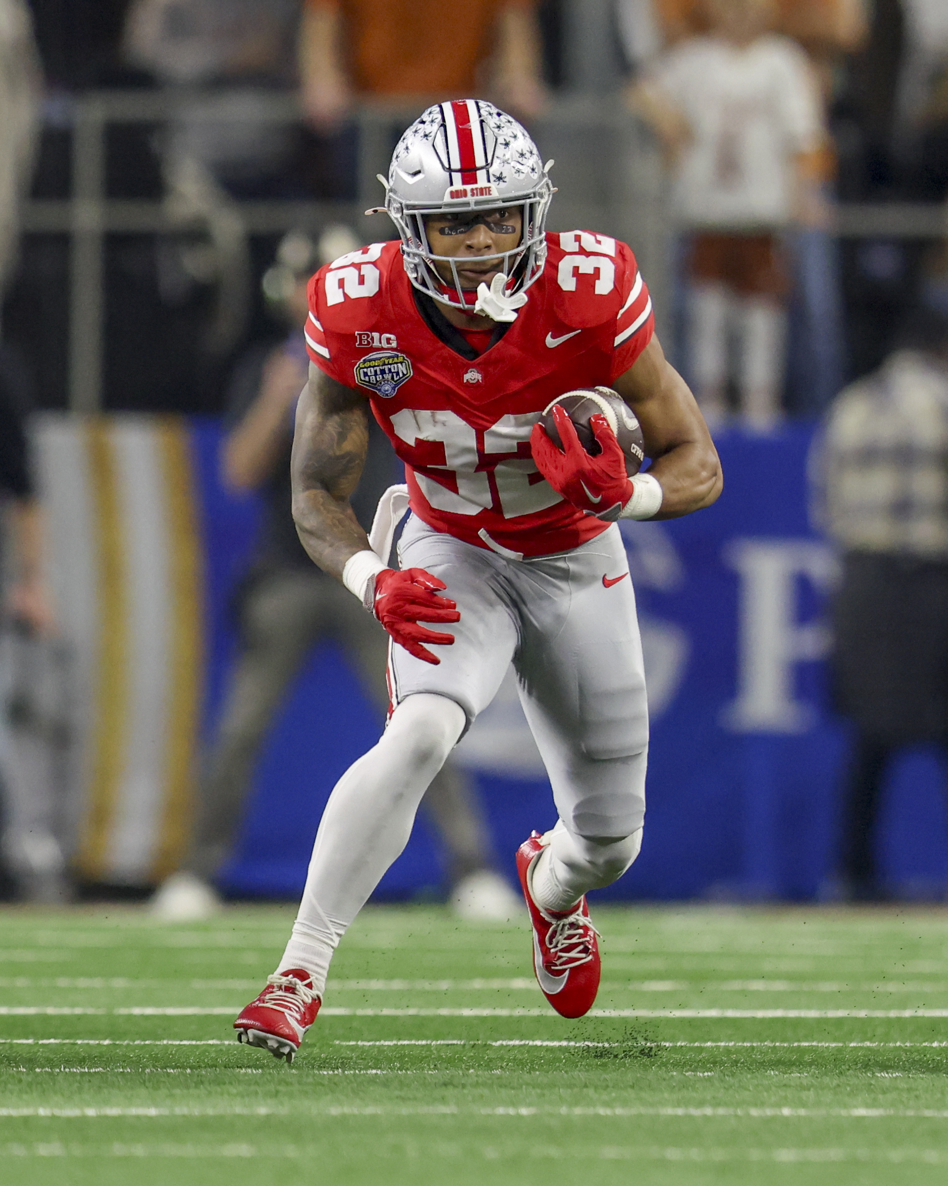 Ohio State running back TreVeyon Henderson (32) rushes during the Cotton Bowl College Football Playoff semifinal game against Texas, Friday, Jan. 10, 2025, in Arlington, Texas. (AP Photo/Gareth Patterson) (Gareth Patterson)