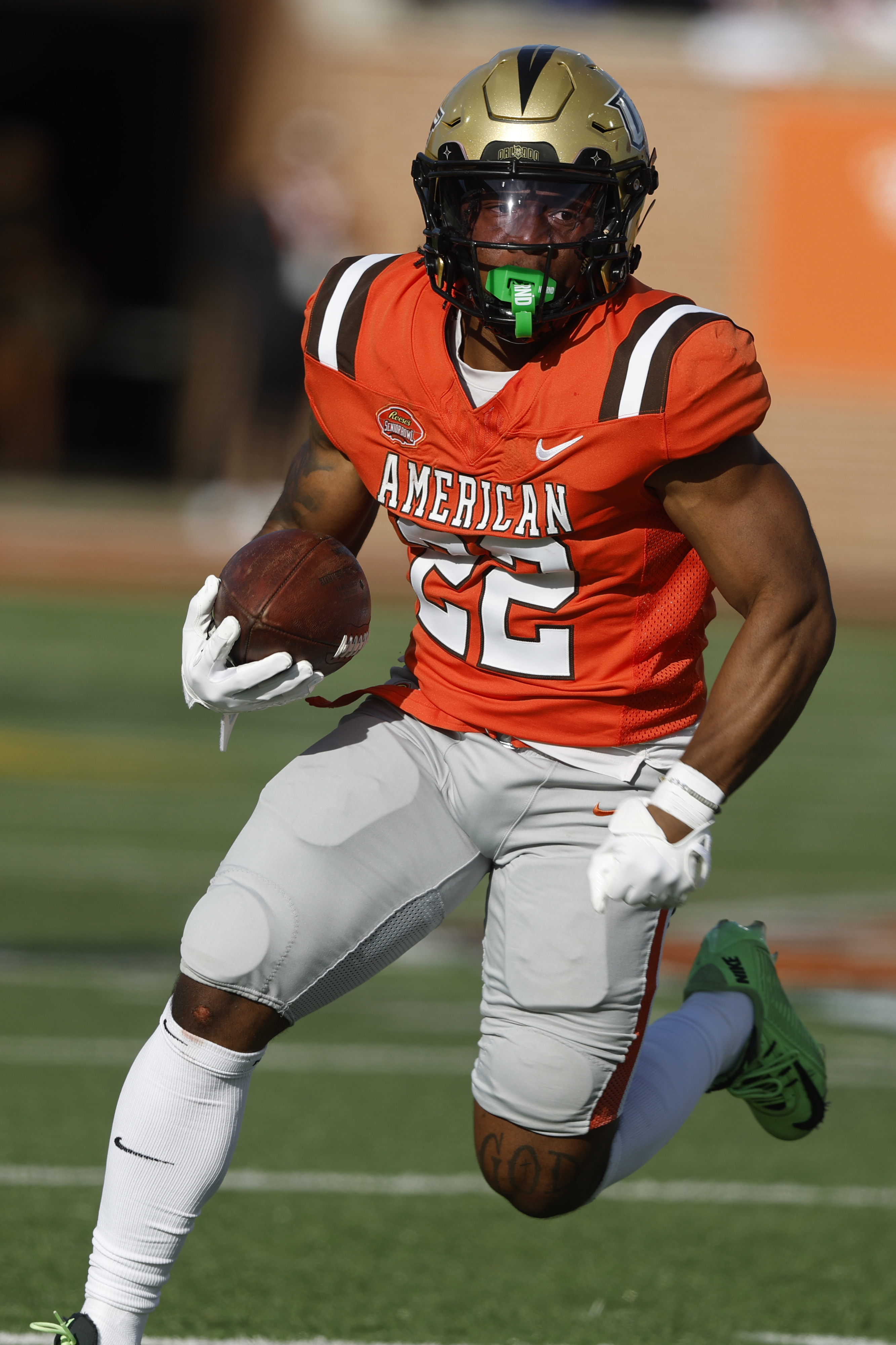 American team running back RJ Harvey (22), of UCF, carries the ball during the second half of the Senior Bowl NCAA college football game, Saturday, Feb. 1, 2025, in Mobile, Ala. (AP Photo/Butch Dill) (Butch Dill)
