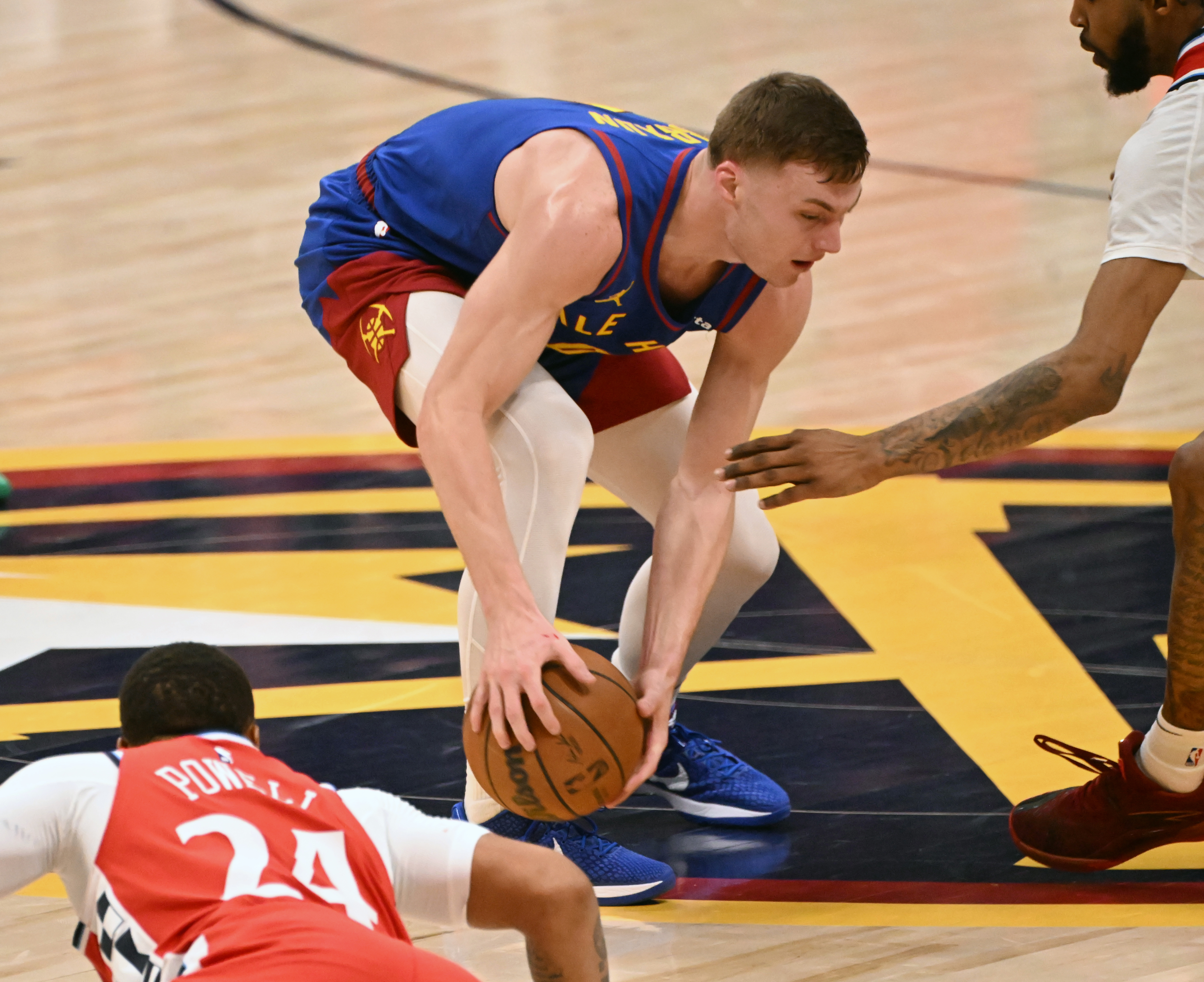 Nuggets Christian Braun steals the ball from Clippers Norman Powell during the second quarter of the first series of the NBA playoffs at Ball Arena on Saturday, April 19, 2025. The Nuggets won the game in overtime 112-110. (Jerilee Bennett,The Gazette)