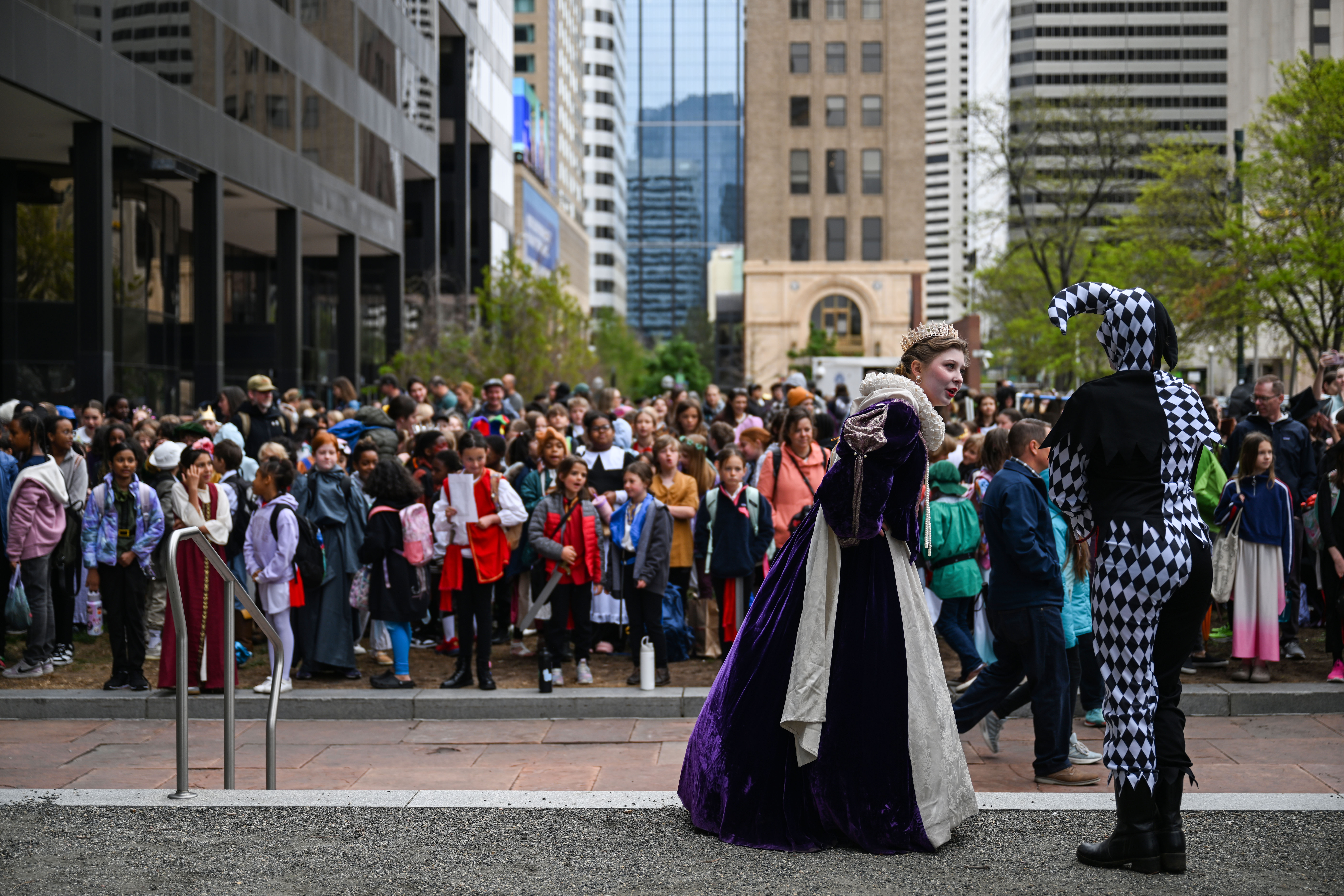 Queen Elizabeth addresses her court jester as 5,000 students of all ages from Denver Public Schools prepare to march from Skyline park to the Denver Center for Performing Arts during the opening parade to kick off the 41st Annual DPS Shakespeare Festival on Friday, April 25, 2025. The festival is the oldest and largest student Shakespeare festival in the country. (Stephen Swofford, Denver Gazette) (StephenSwoffordPhotographerstephen.swofford@gazette.comhttps://secure.gravatar.com/avatar/1ddcaf11c5d70eaa58546ddc4e038687?d=mm&r=g)