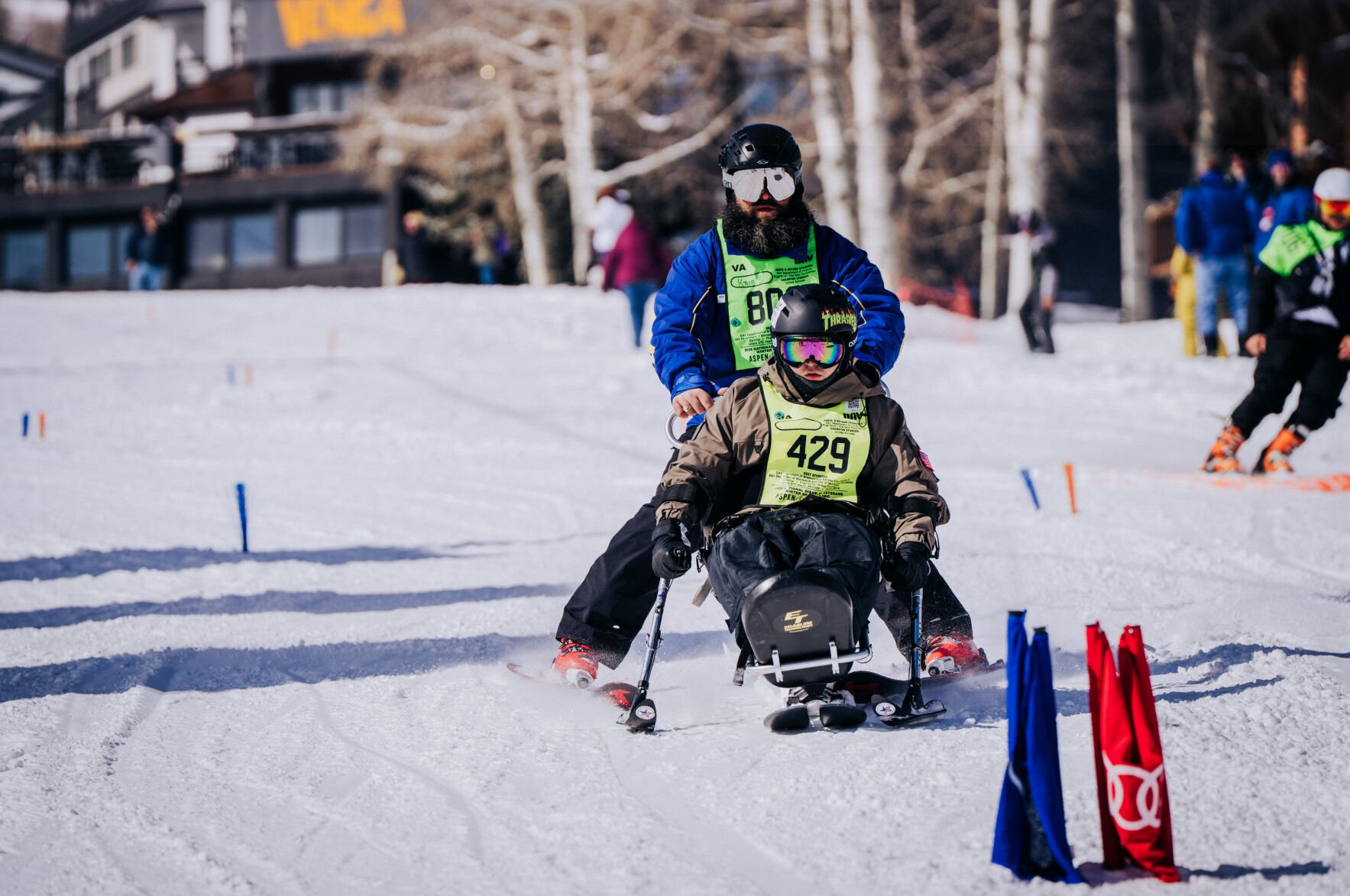 Navy veteran Jeremy Trammell Jr., front, races down the slope of a ski run during the National Disabled Veterans Winter Sports Clinic in Snowmass earlier this month. (photos by U.S. Department of Veterans Affairs)