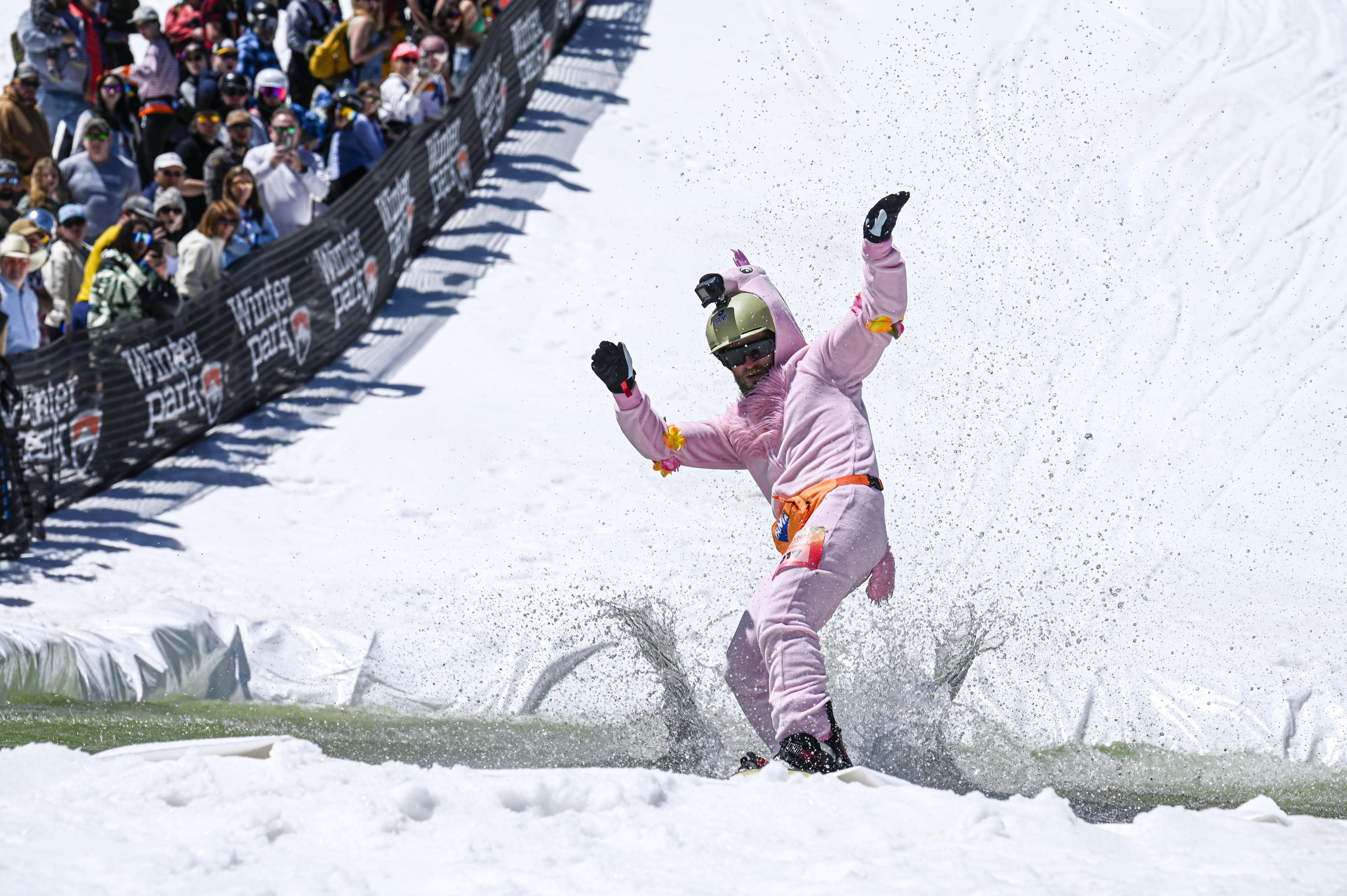 John Bohlinger skis across a pool of water at the base of Winter Park during the Spring Splash event celebrating the last day of skiing at the resort for the season on Sunday, April 27, 2025. (Stephen Swofford, Denver Gazette) (StephenSwoffordPhotographerstephen.swofford@gazette.comhttps://secure.gravatar.com/avatar/1ddcaf11c5d70eaa58546ddc4e038687?d=mm&r=g)