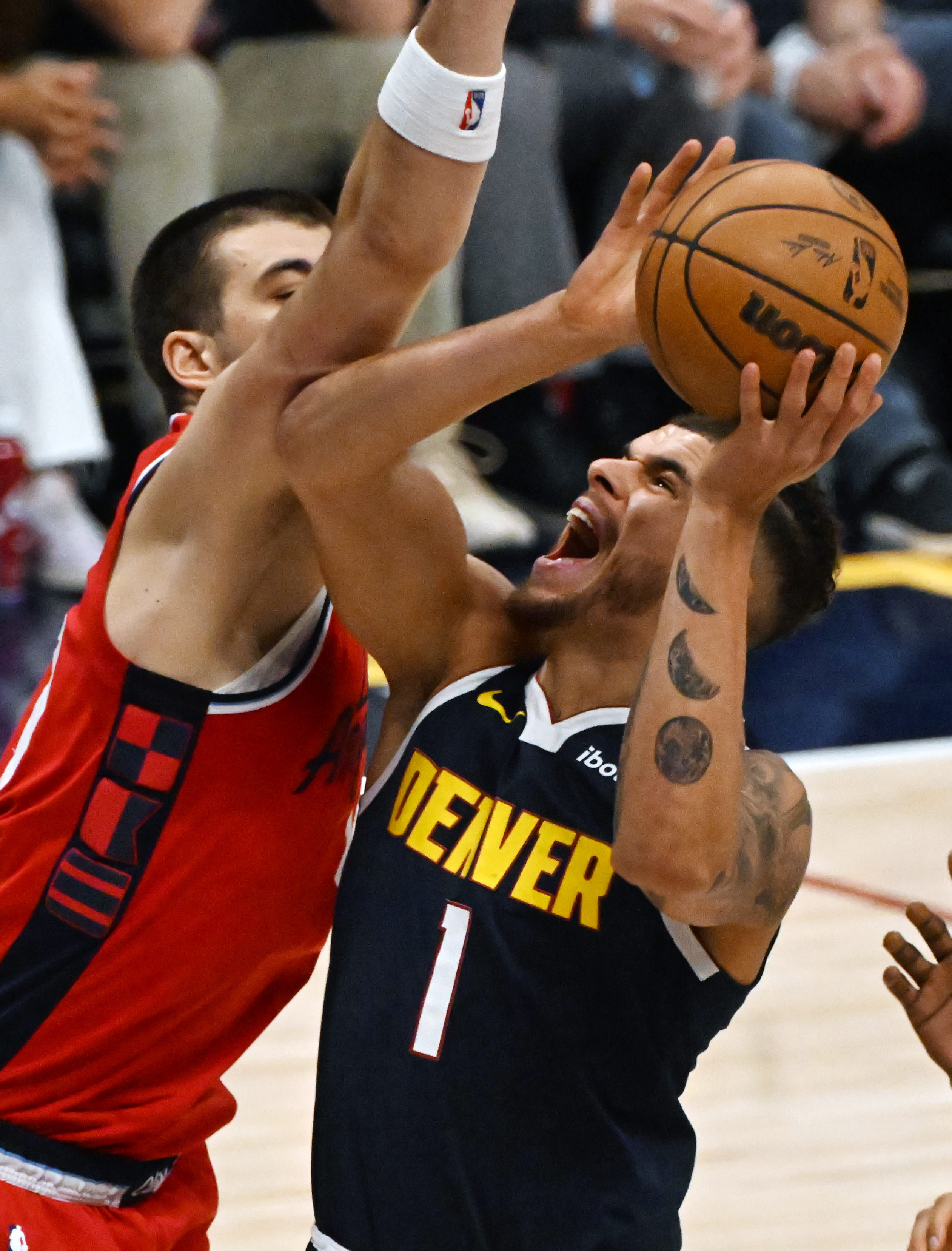 LA Clippers center Ivica Zubac (40) puts pressure on Denver Nuggets forward Michael Porter Jr. (1) while he’s shooting during the 2nd quarter of game 2 of Round 1 of the NBA Western Championship at Ball Arena on Monday, April 21, 2025. (Jerilee Bennett,The Gazette)