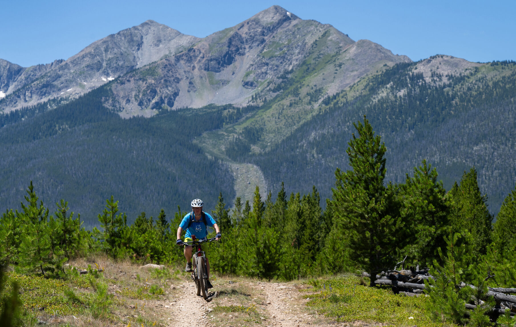 Peak One towers over a mountain biker as he rides through the Frisco Peninsula Recreation Area last July. (Christian Murdock, The Gazette)