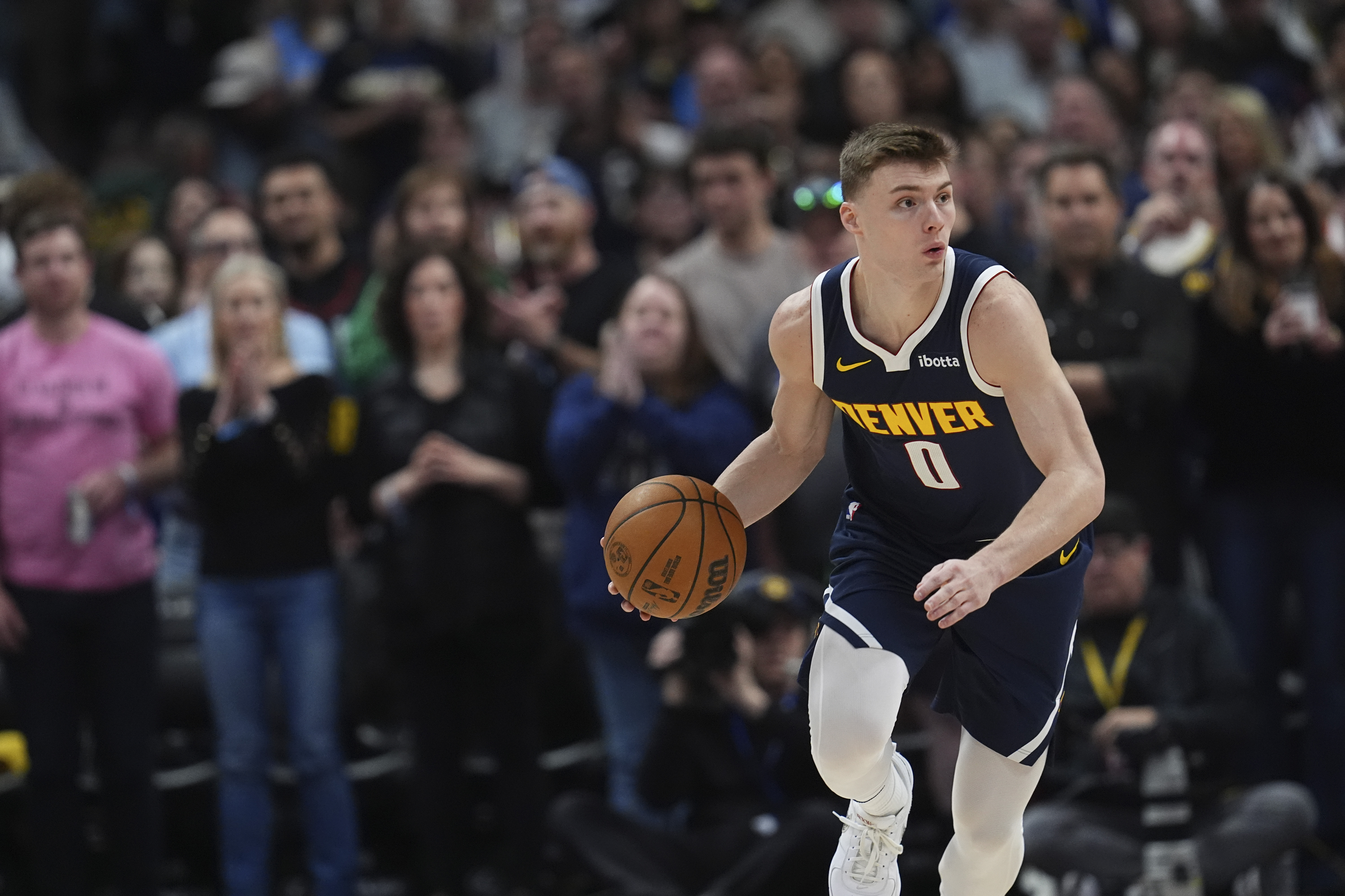Denver Nuggets guard Christian Braun (0) in the first half of an NBA basketball game Friday, March 28, 2025, in Denver. (AP Photo/David Zalubowski) (David Zalubowski)