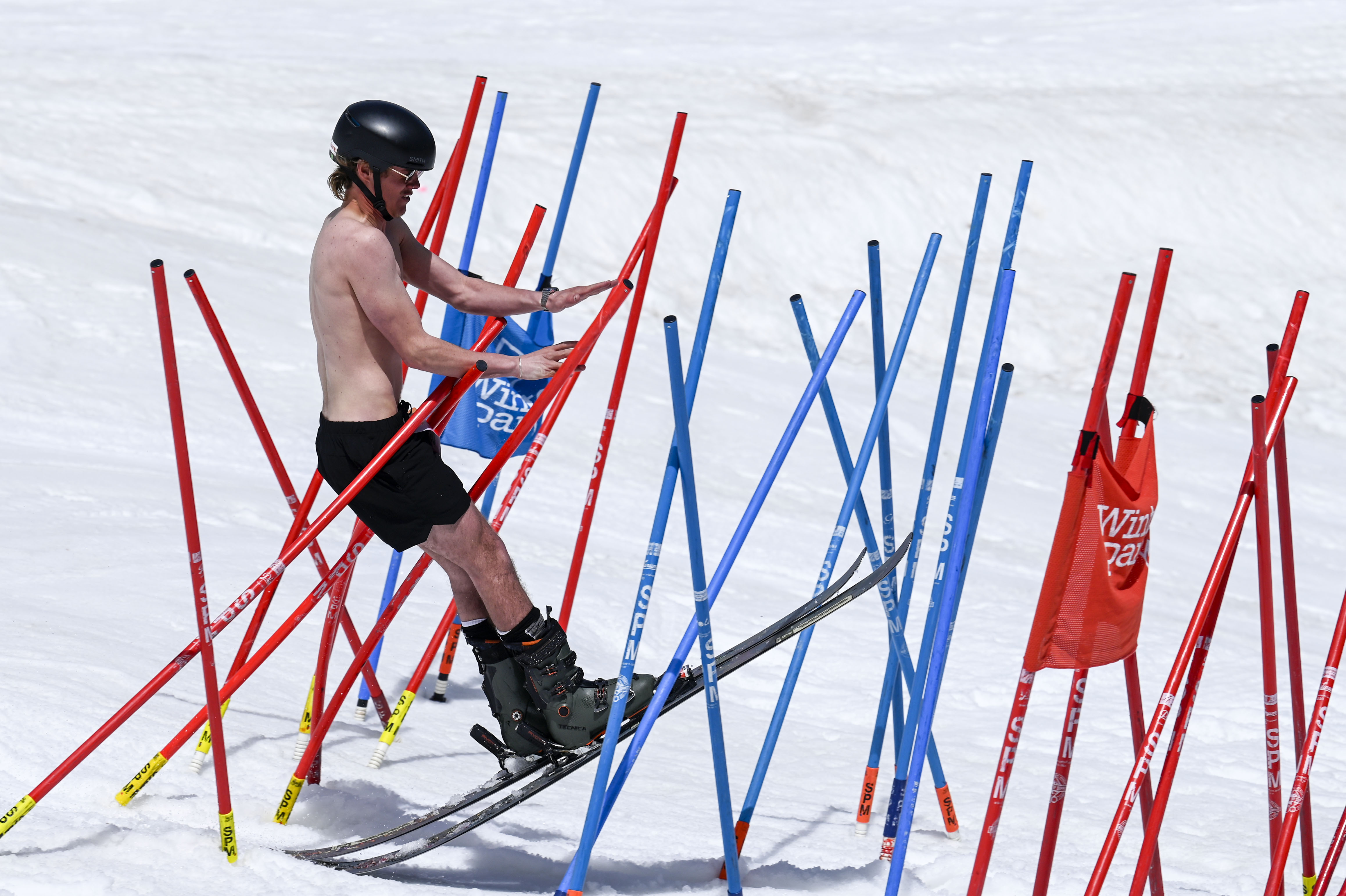 A skier crosses through the “bamboo forest”, part of an obstacle course ending with a pool of water at the base of Winter Park during the Spring Splash event to celebrate the last day of the season on Sunday, April 27, 2025 (Stephen Swofford, Denver Gazette) (StephenSwoffordPhotographerstephen.swofford@gazette.comhttps://secure.gravatar.com/avatar/1ddcaf11c5d70eaa58546ddc4e038687?d=mm&r=g)
