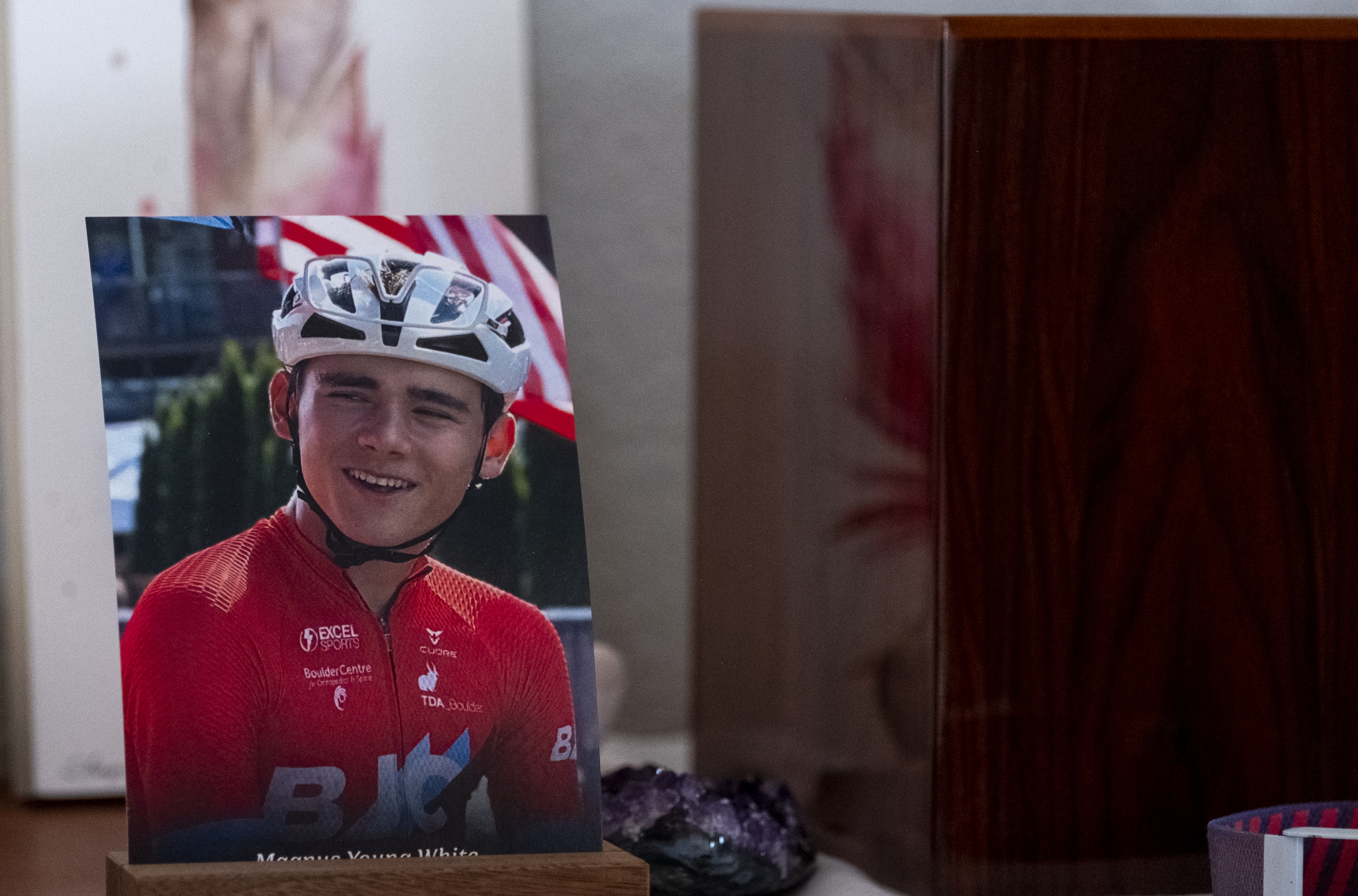 A photograph of Magnus White sits next to the urn his ashes are in at the White family residence in Boulder, as seen Thursday, Dec. 14, 2023. White was killed after being struck by a car while riding his bicycle on the Diagonal Highway between Boulder and Longmont on July 29. (Jonathan Ingraham/Denver Gazette) (JonathanIngrahamDigital Strategistjonathan.ingraham@denvergazette.comhttps://denvergazette.com/content/tncms/avatars/c/dd/7f0/cdd7f086-b693-11ec-b373-bba598953eb6.fc0f5608a6f1144f64f080f771bd904d.png)